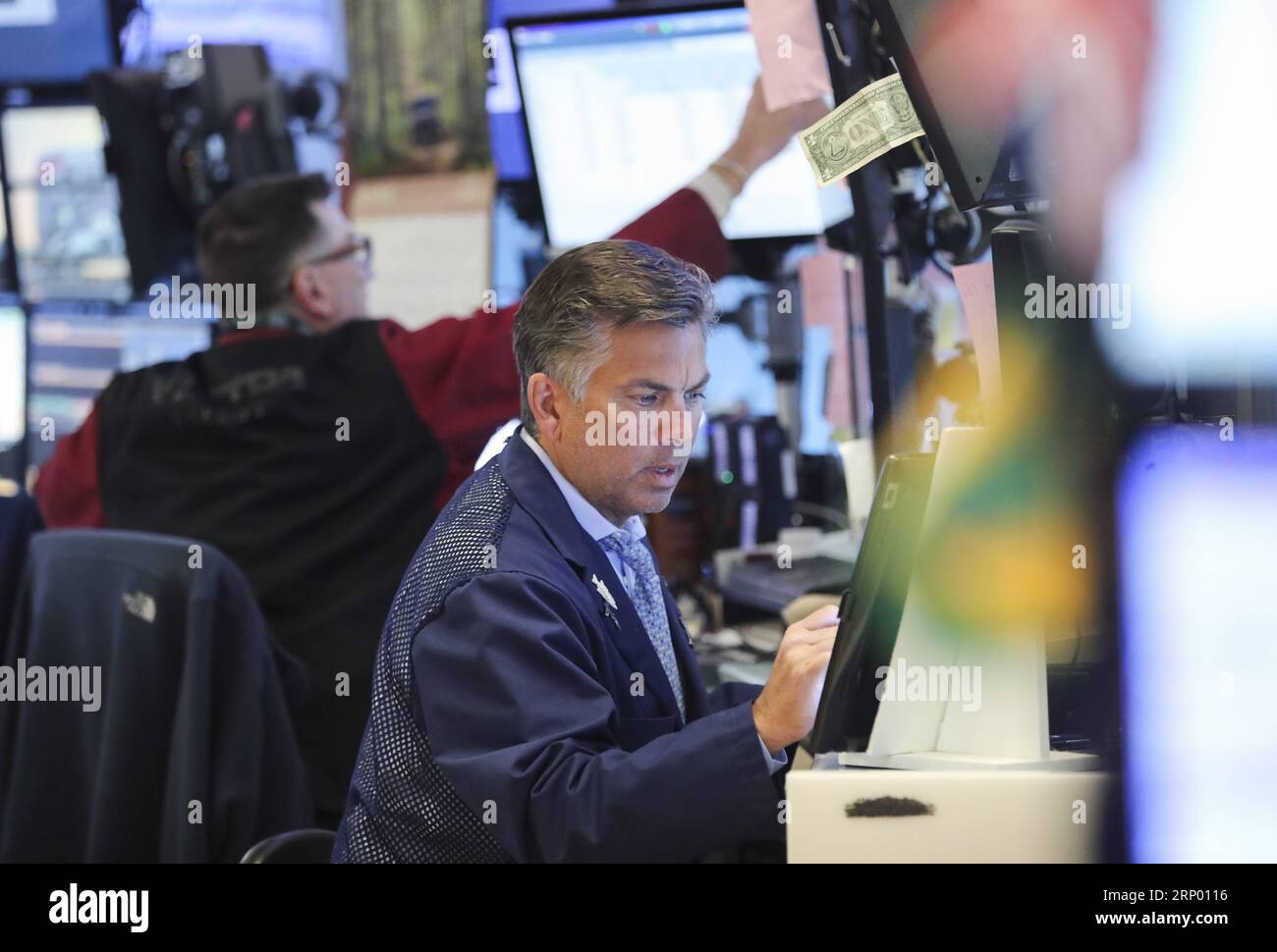 (180411) -- NEW YORK, April 11, 2018 -- Traders work at the New York Stock Exchange in New York, the United States, April 11, 2018. U.S. stocks closed lower on Wednesday. The Dow decreased 0.90 percent to 24,189.45, and the S&P 500 erased 0.55 percent to 2,642.19, while the Nasdaq lost 0.36 percent to 7,069.03. ) U.S.-NEW YORK-STOCKS WangxYing PUBLICATIONxNOTxINxCHN Stock Photo