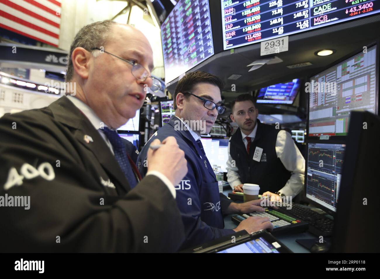 (180411) -- NEW YORK, April 11, 2018 -- Traders work at the New York Stock Exchange in New York, the United States, April 11, 2018. U.S. stocks closed lower on Wednesday. The Dow decreased 0.90 percent to 24,189.45, and the S&P 500 erased 0.55 percent to 2,642.19, while the Nasdaq lost 0.36 percent to 7,069.03. ) U.S.-NEW YORK-STOCKS WangxYing PUBLICATIONxNOTxINxCHN Stock Photo