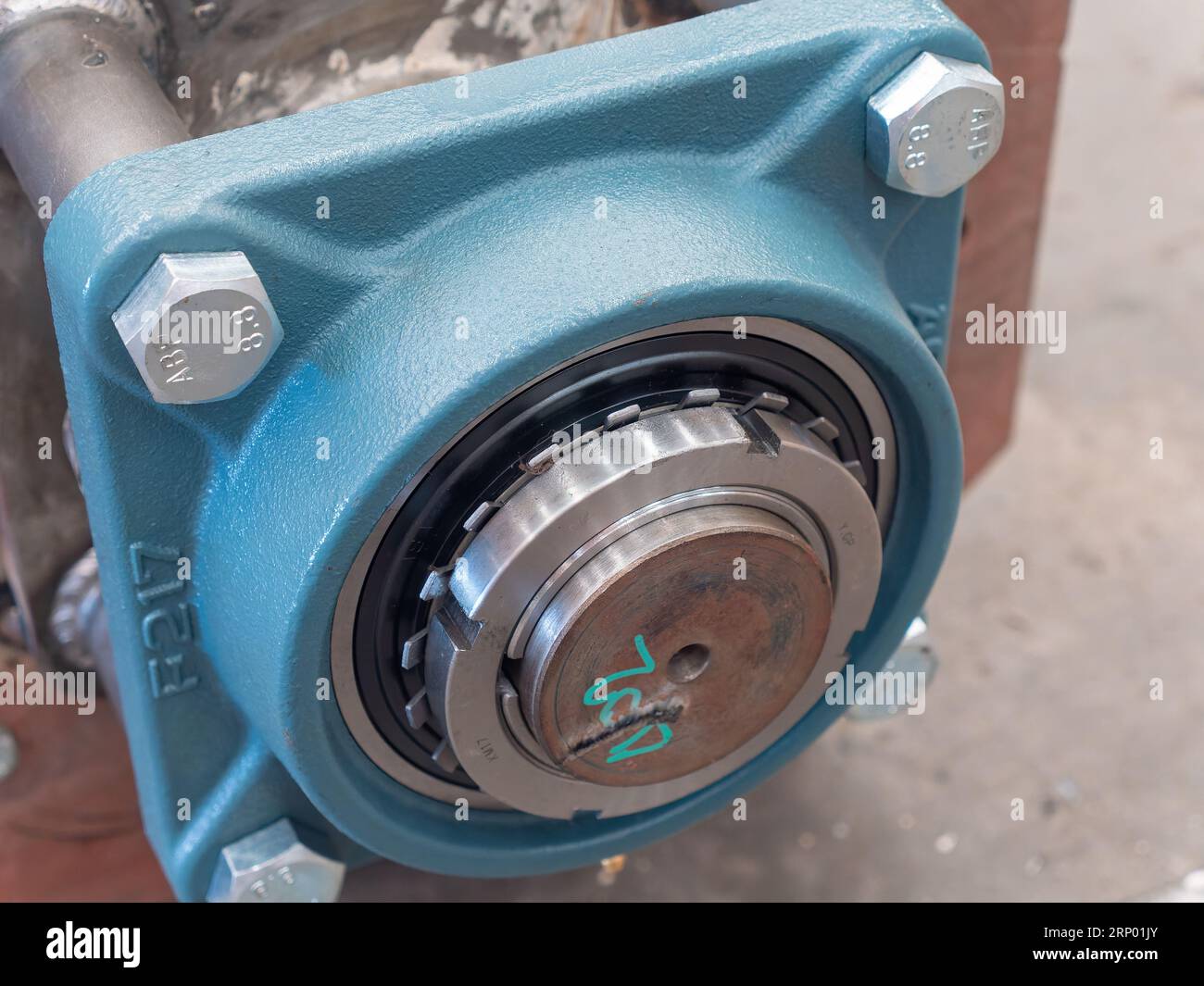 Ball bearing with housing and end of drive shaft visible Stock Photo