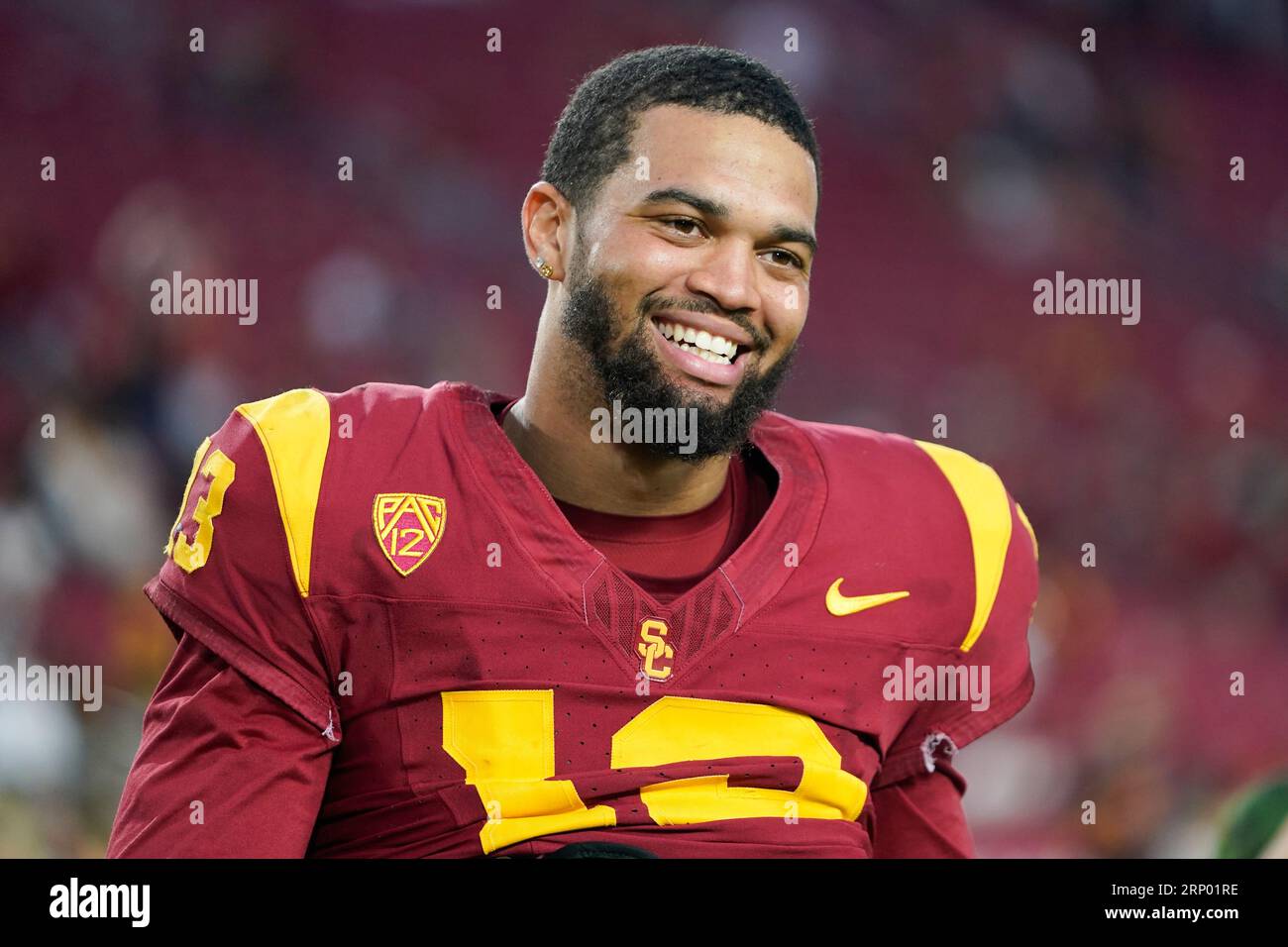 Southern California quarterback Caleb Williams smiles while walking off
