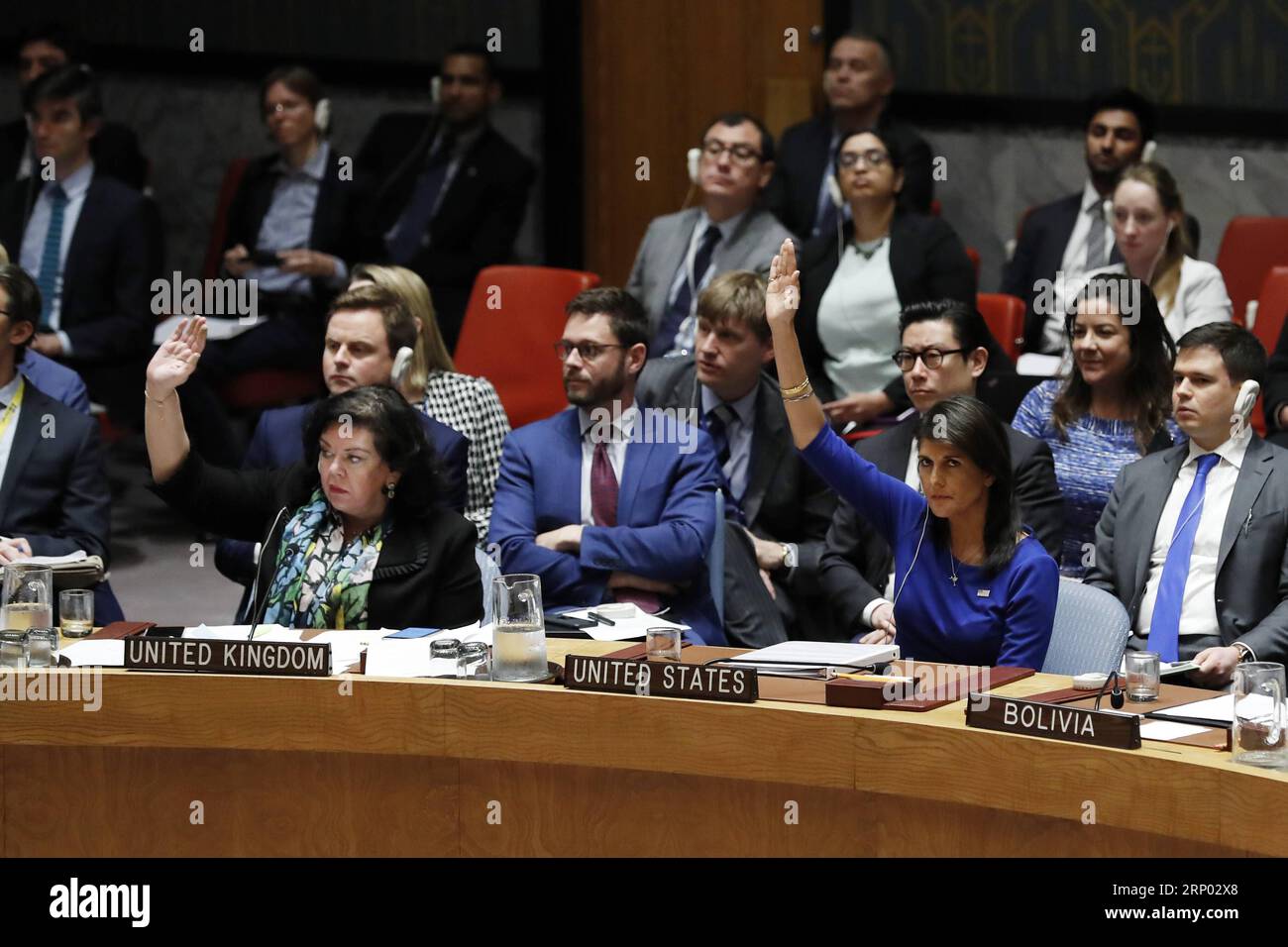 (180414) -- UNTIED NATIONS, April 14, 2018 -- U.S. Ambassador to the United Nations Nikki Haley (R, Front) and British Ambassador to UN Karen Pierce (L, Front) vote against a draft resolution on Syria at the UN headquarters in New York, April 14, 2018. A Russian-drafted resolution, which would have condemned the military strikes on Syria carried out by the United States, France and Britain, failed to be adopted by the Security Council. ) UN-SECURITY COUNCIL-SYRIA-DRAFT RESOLUTION-FAILING LixMuzi PUBLICATIONxNOTxINxCHN Stock Photo
