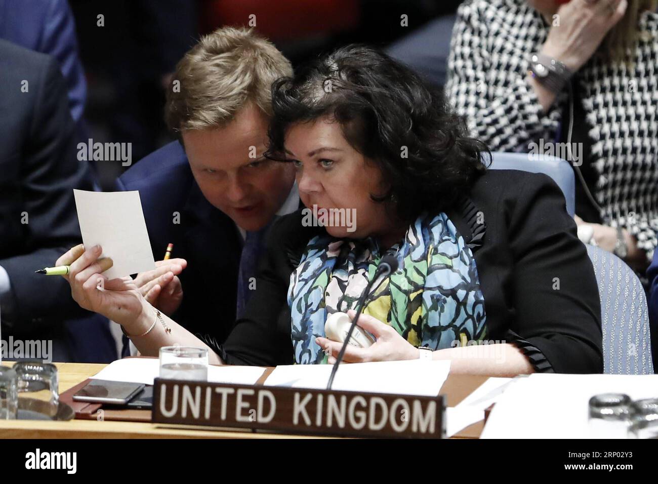 (180414) -- UNTIED NATIONS, April 14, 2018 -- British Ambassador to the United Nations Karen Pierce (Front) listens to one of her delegation during a Security Council emergency meeting on Syria at the UN headquarters in New York, April 14, 2018. UN Security Council held an emergency meeting on Syria requested by Russia on Saturday. UN Secretary-General Antonio Guterres expressed concern over Friday s joint military action against Syria by the United States, France and Britain, and called for adherence to the UN Charter and international law on the issue. ) UN-SECURITY COUNCIL-SYRIA-EMERGENCY M Stock Photo