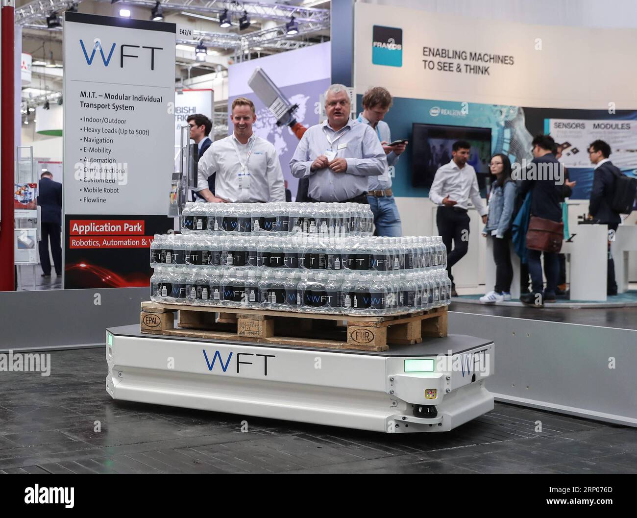 (180423) -- HANOVER (GERMANY), April 23, 2018 -- Visitors watch a presentation of intelligent logistics at the booth of WFT during the Hanover Fair 2018 in Hanover, Germany, on April 23, 2018. Hanover Fair, the world s leading industrial trade show, opened on Sunday, as German Chancellor Angela Merkel stressed the importance of free trade. ) GERMANY-HANOVER-HANOVER FAIR ShanxYuqi PUBLICATIONxNOTxINxCHN Stock Photo