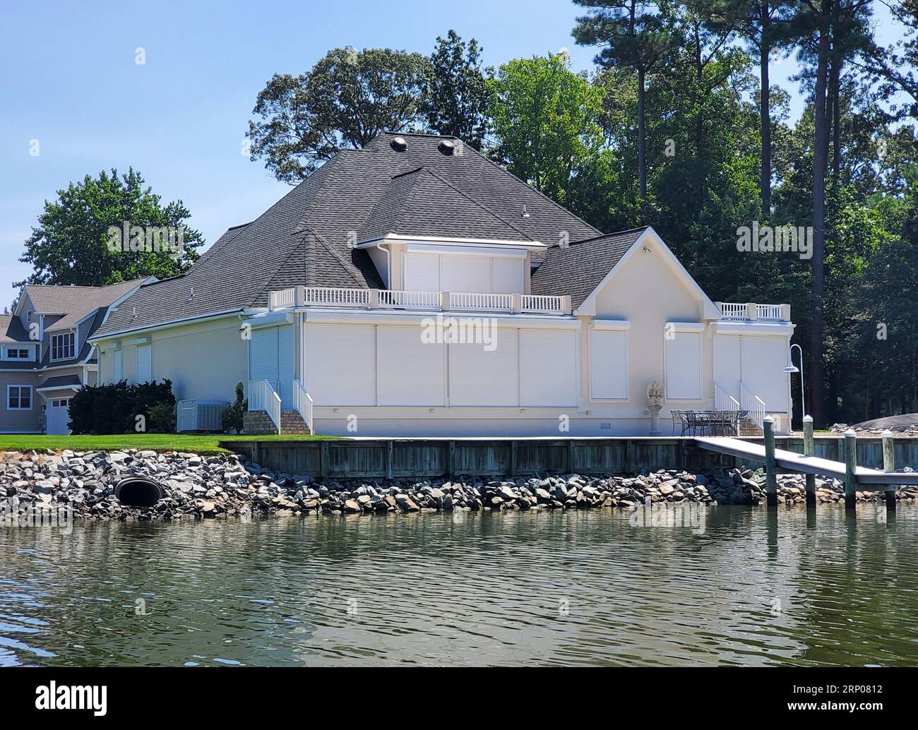 A house with windows covered with hurricane shutters near Rehoboth