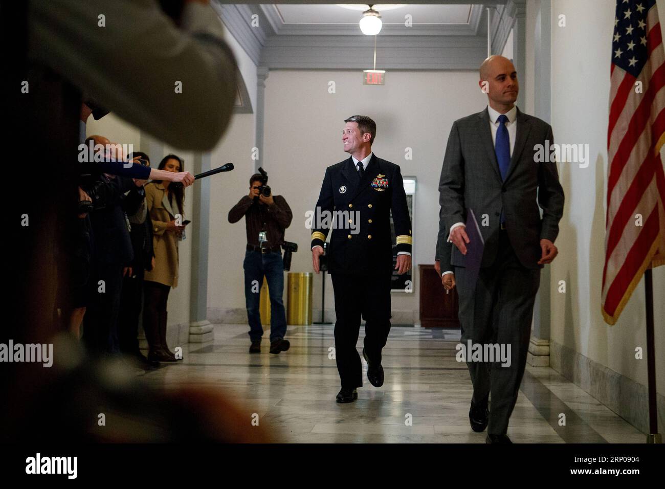 (180426) -- WASHINGTON, April 26, 2018 -- Veterans Affairs Secretary nominee Ronny Jackson (C) is seen on Capitol Hill in Washington D.C., the United States, on April 16, 2018. White House physician Ronny Jackson announced on April 26 that he had withdrawn from President Donald Trump s nomination to be the next Veterans Affairs Secretary, in the wake of a series of allegations that he had fostered a hostile work environment and behaved improperly while serving as the top doctor in the White House. ) U.S.-WASHINGTON D.C.-VETERANS AFFAIRS SECRETARY-NOMINEE-WITHDRAWAL TingxShen PUBLICATIONxNOTxIN Stock Photo