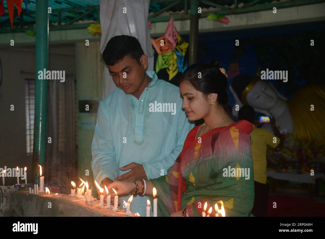 (180429) -- DHAKA, April 29, 2018 () -- Devotees light candles during Buddha Purnima celebration in Dhaka, Bangladesh on April 29, 2018. Bangladesh s Buddhist community Sunday celebrated Buddha Purnima , in a befitting manner, which marks holy Gautama Buddha s birth, enlightenment and death. () (wtc) BANGLADESH-DHAKA-BUDDHA-FESTIVAL xinhua PUBLICATIONxNOTxINxCHN Stock Photo