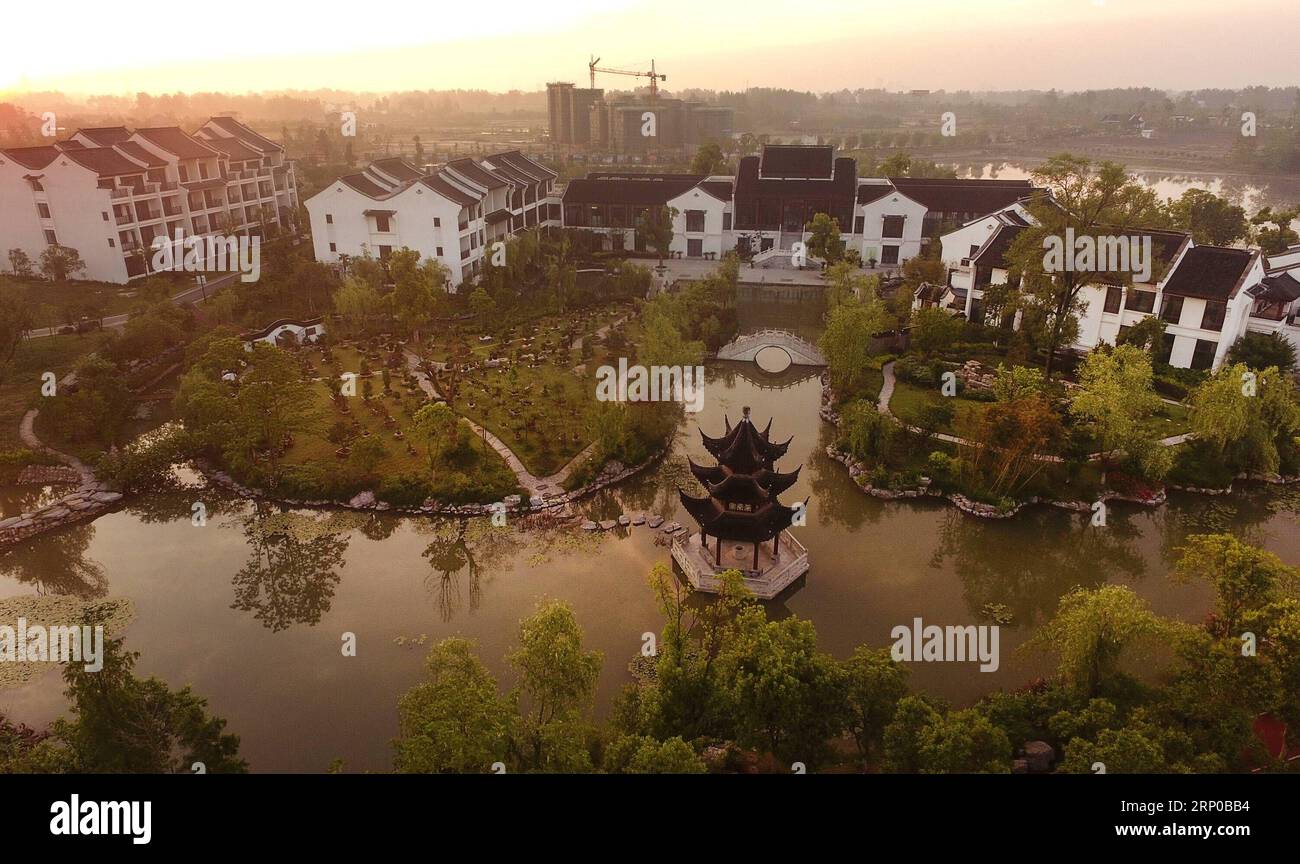 (180503) -- LU AN, May 3, 2018 -- Aerial photo taken on May 3, 2018 shows a small town at sunrise in Yu an District of Lu an City, east China s Anhui Province. A nature-friendly small town was built on a wasteland in China s eastern city of Lu an, which attracts more and more tourists coming here to enjoy its idyllic scenery. ) (sxk) CHINA-ANHUI-LU AN-RURAL CONSTRUCTION (CN) TaoxMing PUBLICATIONxNOTxINxCHN Stock Photo