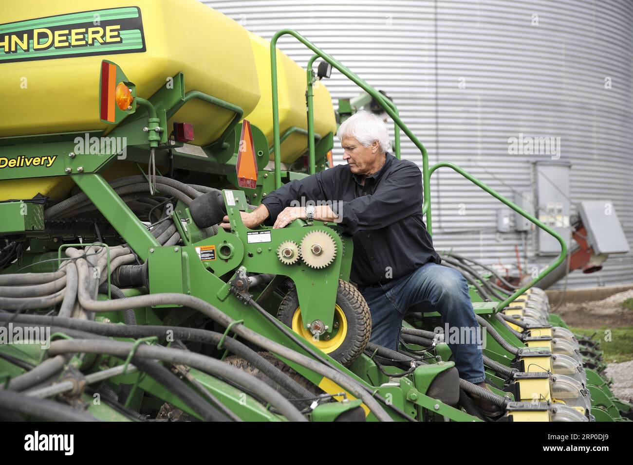 (180509) -- IOWA, May 9, 2018 -- Rick Kimberley checks a farming combine machine at his farm near Des Moines, capital of Iowa State, May 3, 2018. Rick and his son, Grant, grow more than 4,000 acres of corn and soybeans with a couple of hired hands and massive combines whose computers precisely track yield, moisture and other key statistics for each row and acre. He has been to China 15 times in recent years to talk about precision farming and other tricks of his trade, becoming an ambassador for modern farming methods in China. As for the current trade tensions between the United States and Ch Stock Photo