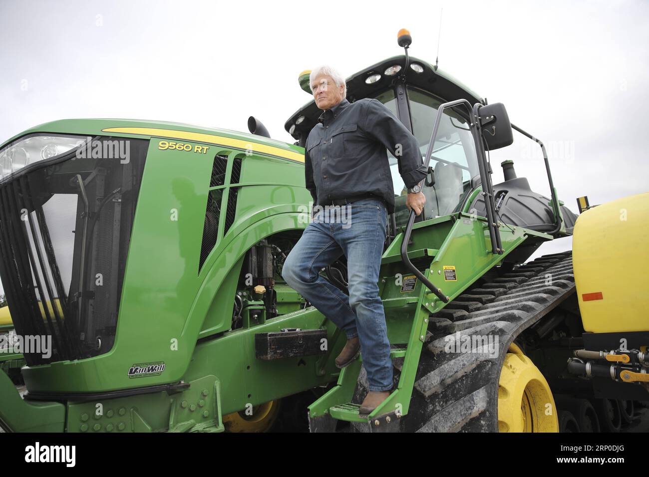 (180509) -- IOWA, May 9, 2018 -- Rick Kimberley walks down a farming combine machine at his farm near Des Moines, capital of Iowa State, May 3, 2018. Rick and his son, Grant, grow more than 4,000 acres of corn and soybeans with a couple of hired hands and massive combines whose computers precisely track yield, moisture and other key statistics for each row and acre. He has been to China 15 times in recent years to talk about precision farming and other tricks of his trade, becoming an ambassador for modern farming methods in China. As for the current trade tensions between the United States an Stock Photo
