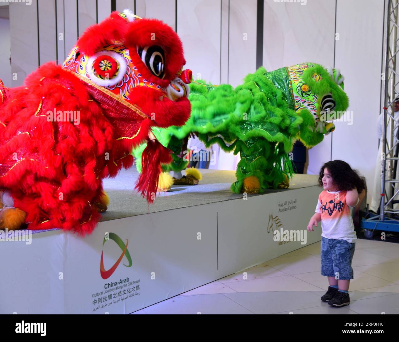 (180512) -- DAMMAM, May 12, 2018 -- Chinese actors perform at a shopping mall in Dammam, Saudi Arabia on May 11, 2018. A Chinese arts delegation for dragon and lion dance and martial arts is giving performances in two big cities in Saudi Arabia. The performances which started on May 8 will last until May 12. ) (srb) SAUDI ARABIA-DAMMAM-CHINA-CULTURE-SHOW WangxBo PUBLICATIONxNOTxINxCHN Stock Photo
