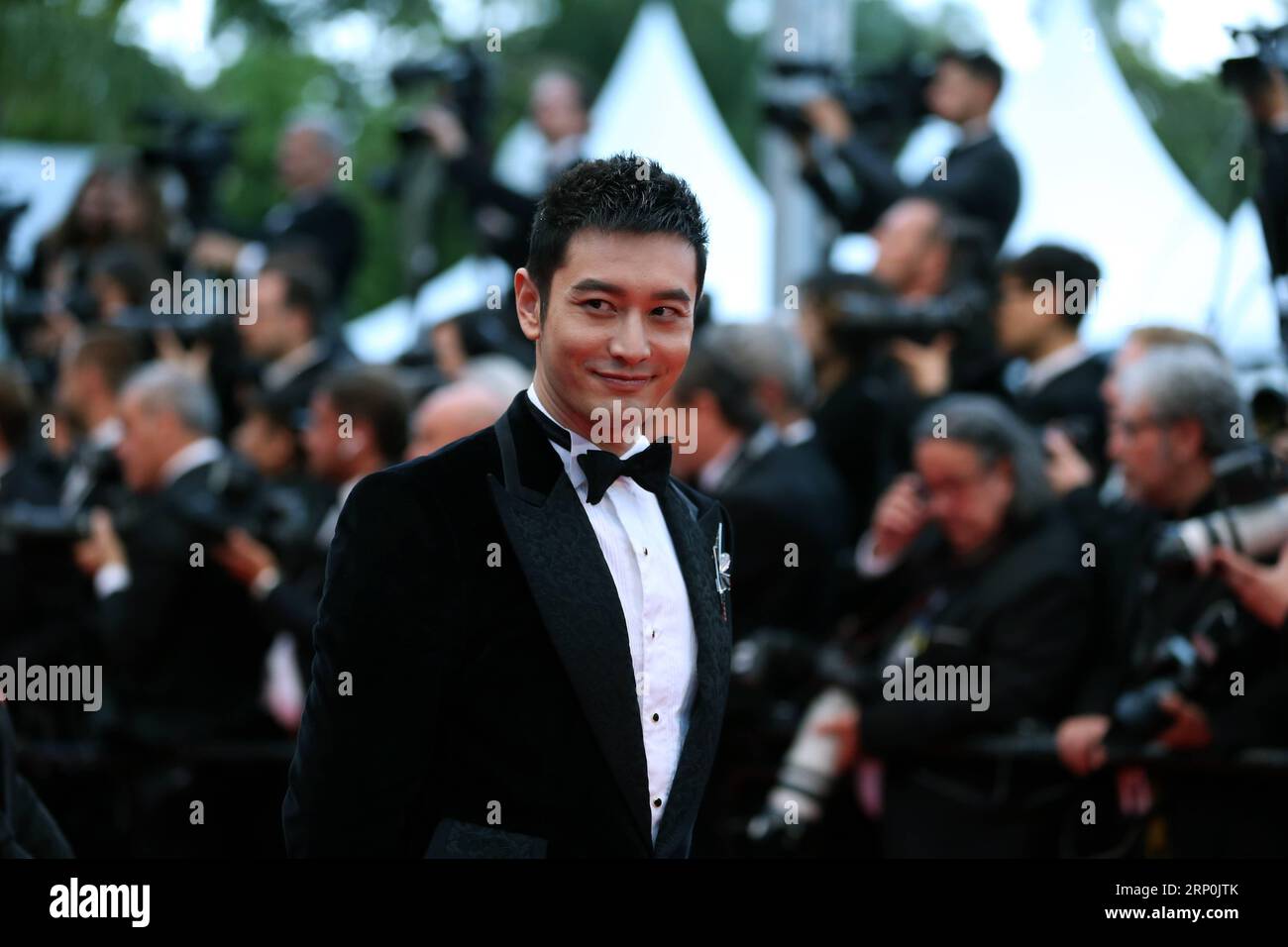 (180517) -- CANNES, May 17, 2018 -- Chinese actor Huang Xiaoming poses on the red carpet during the premiere of the film Burning at the 71st Cannes International Film Festival in Cannes, France, on May 16, 2018. The 71st Cannes International Film Festival is held from May 8 to May 19. ) (zxj) FRANCE-CANNES-71ST INTERNATIONAL FILM FESTIVAL-HUANG XIAOMING-RED CARPET LuoxHuanhuan PUBLICATIONxNOTxINxCHN Stock Photo