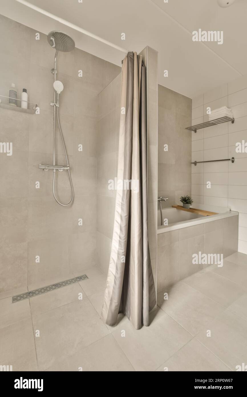 a bathroom with a shower and bathtub in the middle part of the room ...