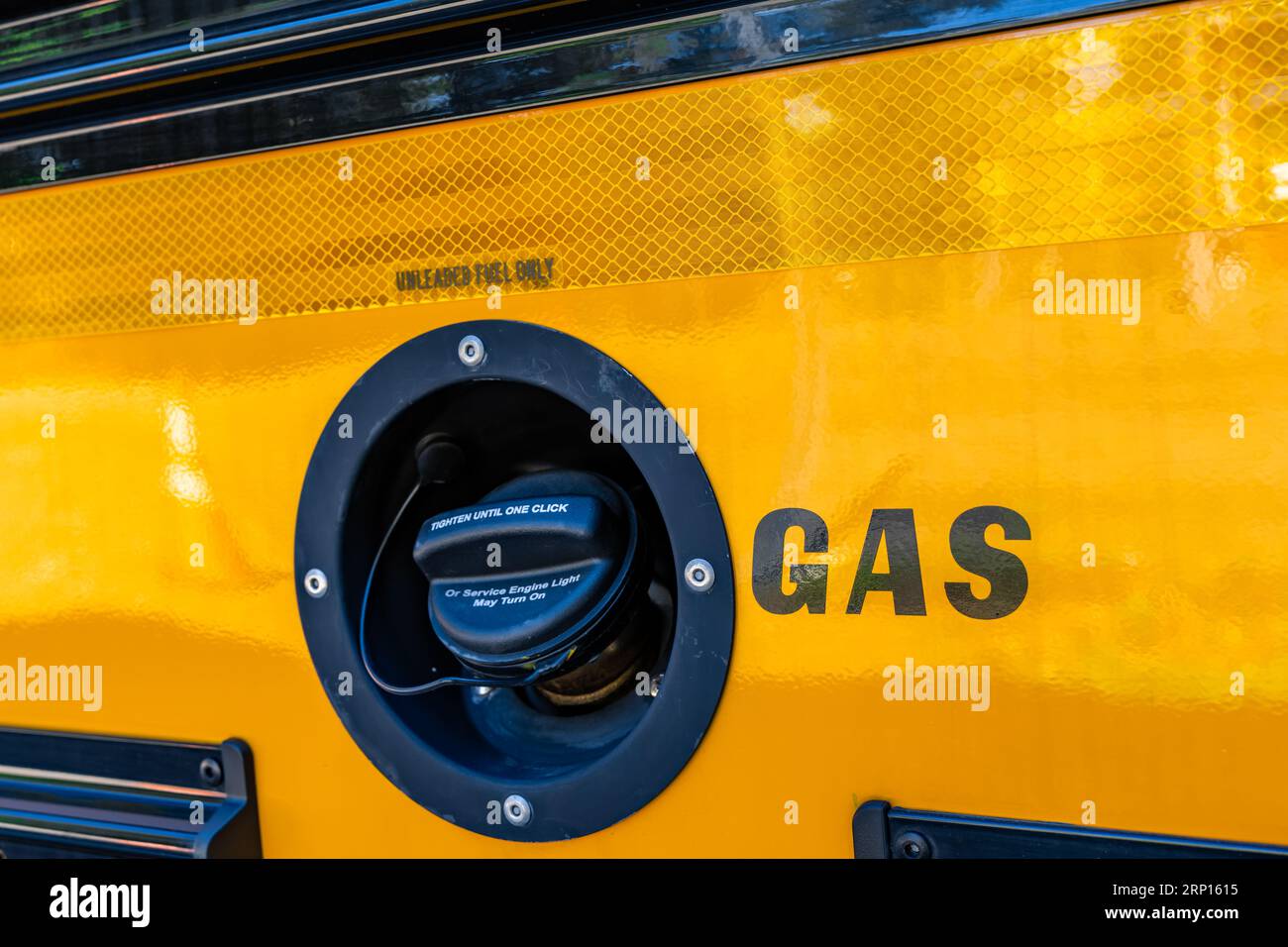Gas cap on the side of a parked yellow school bus Stock Photo - Alamy, image size:1300x956