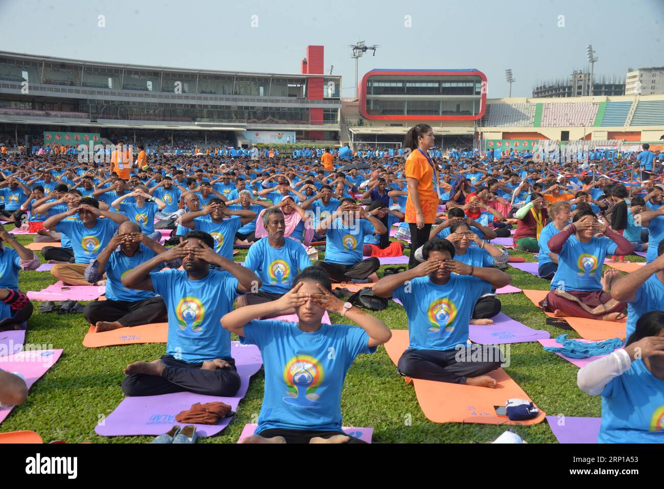 (180621) -- DHAKA, June 21, 2018 () -- People practice yoga during a gathering event marking the International Yoga Day at Bangabandhu National Stadium in Dhaka, Bangladesh on June 21, 2018. The United Nations has declared June 21 as the International Yoga Day. () (zxj) BANGLADESH-DHAKA-INTERNATIONAL YOGA DAY Xinhua PUBLICATIONxNOTxINxCHN Stock Photo