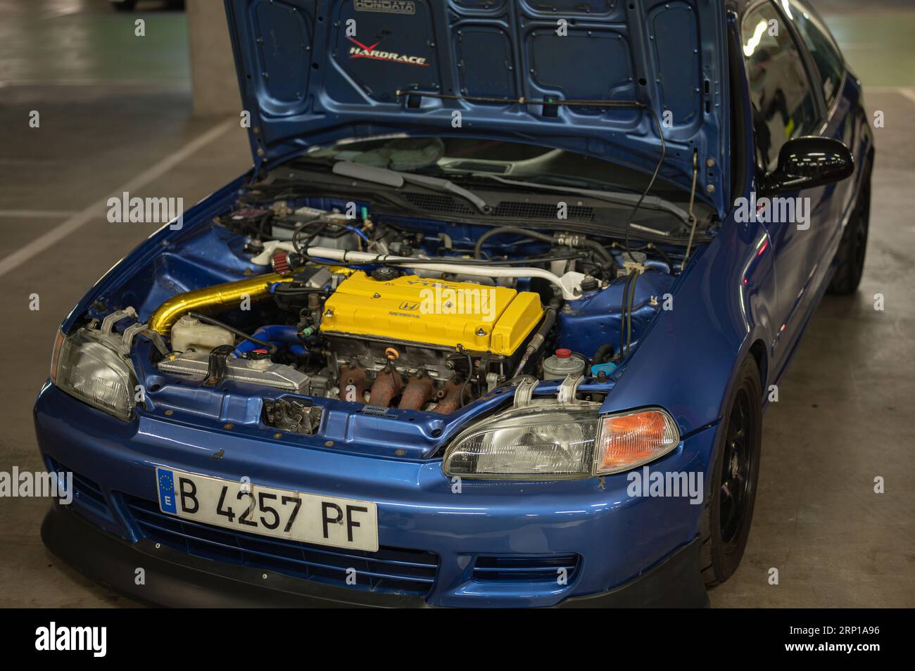 The engine of a Honda Civic EG 1.6 Vtec with an open hood Stock Photo