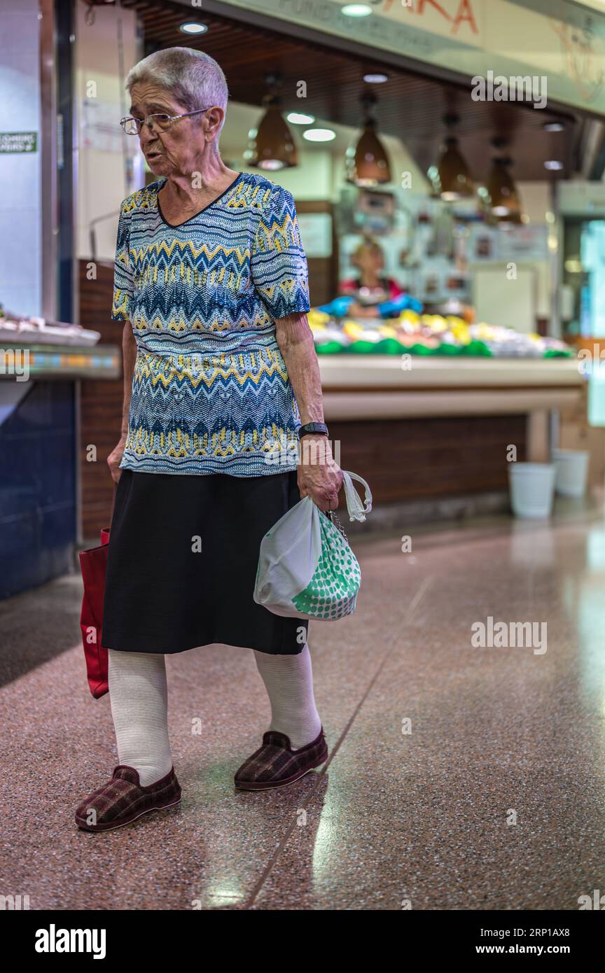 An old lady doing the shopping in the market Stock Photo - Alamy