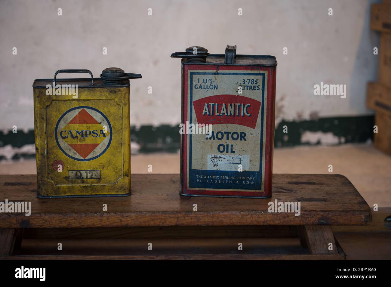 A closeup of two old Campsa and Atlantic motor oil cans Stock Photo Alamy