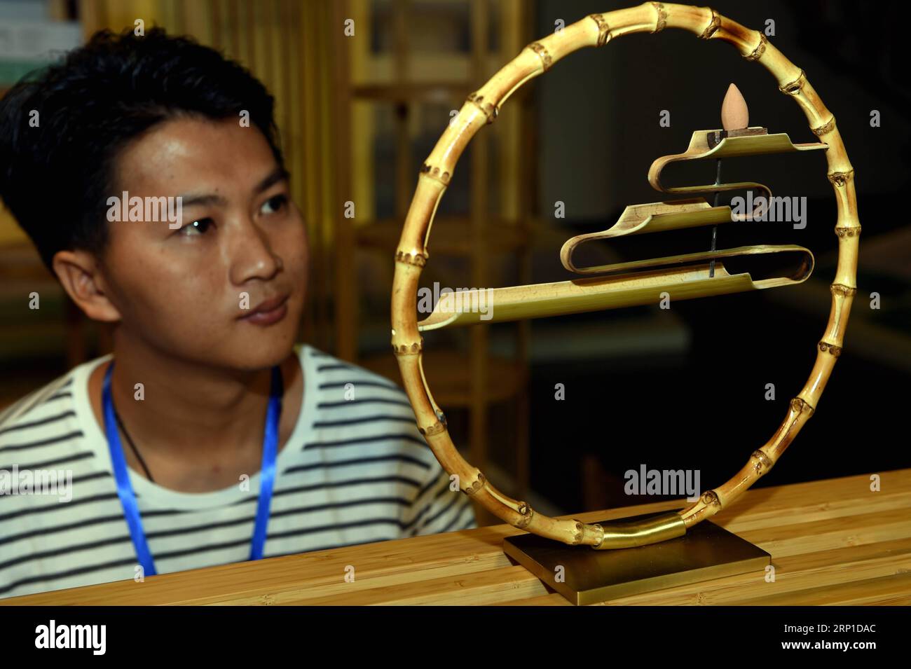 (180627) -- SHAOWU, June 27, 2018 -- Contestant Lai Hanshi from a furniture design firm in Zhongshan of Guangdong Province shows his bamboo design in the final round of Taichi Master Bamboo Industry International Industrial Design Competition 2018 in Shaowu, southeast China s Fujian Province, June 27, 2018. The competition received 6,517 bamboo designs from global contestants, with 25 pieces of works being qualified for the final round. ) (lmm) CHINA-FUJIAN-BAMBOO-INDUSTRIAL DESIGN-COMPETITION (CN) PengxZhangqing PUBLICATIONxNOTxINxCHN Stock Photo