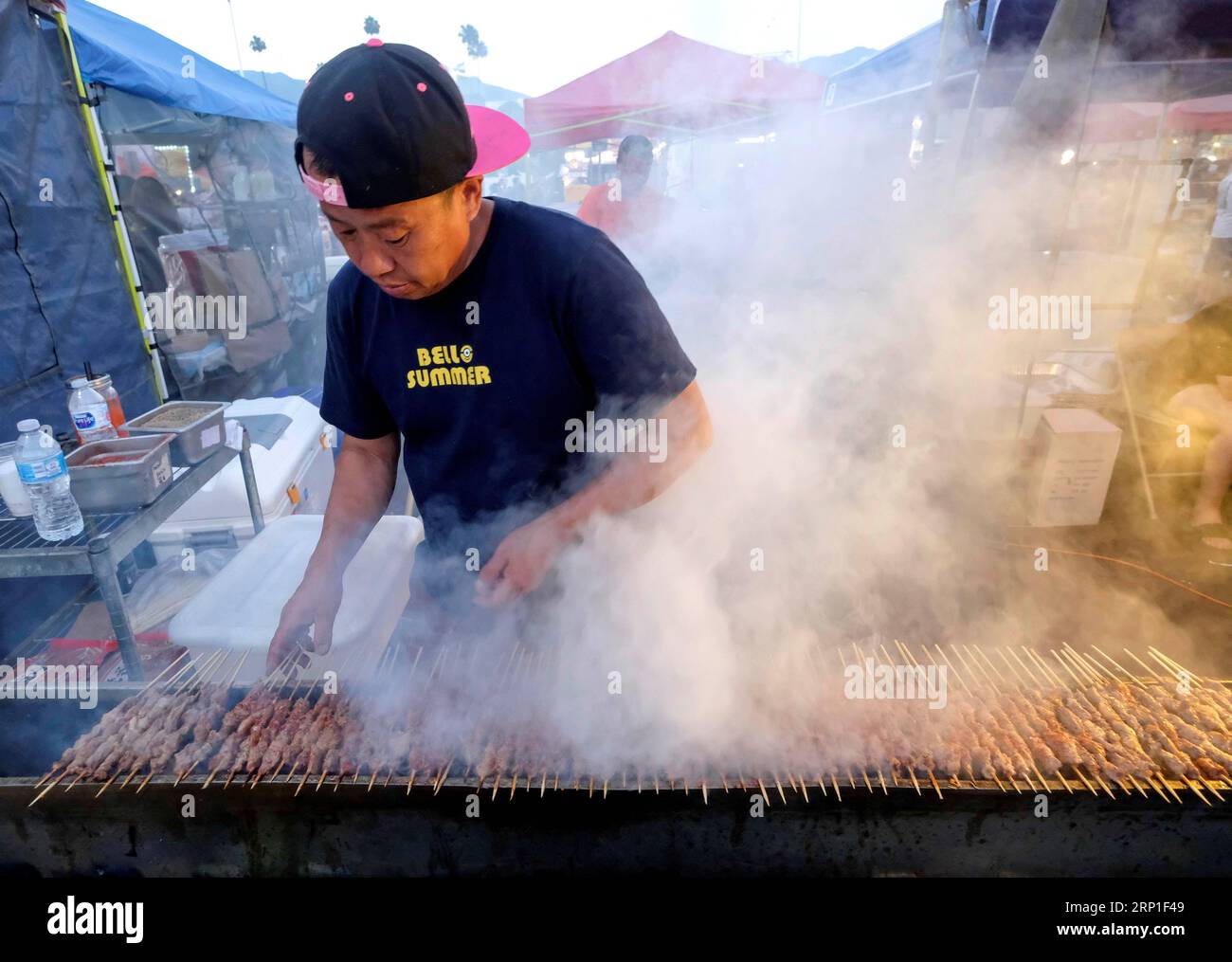 (180702) -- ARCADIA, July 2, 2018 -- A vendor grills lamb skewers at the 626 Night Market in Arcadia, California, the United States on July 1, 2018. 626 is the area code of San Gabriel Valley in Los Angeles, a region with lots of Chinese. From dozens of booths to hundreds of vendors, in recent years, the 626 Night Market has become the largest night market in the United States and a part of the urban culture in Los Angeles. ) (zxj) U.S.-ARCADIA-NIGHT MARKET ZhaoxHanrong PUBLICATIONxNOTxINxCHN Stock Photo