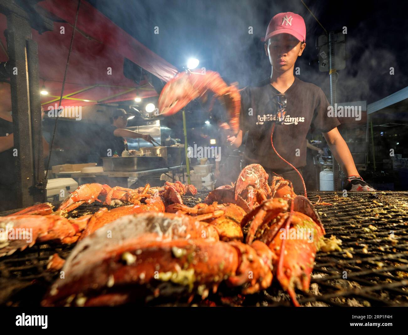 (180702) -- ARCADIA, July 2, 2018 -- A vendor cooks lobsters at the 626 Night Market in Arcadia, California, the United States on July 1, 2018. 626 is the area code of San Gabriel Valley in Los Angeles, a region with lots of Chinese. From dozens of booths to hundreds of vendors, in recent years, the 626 Night Market has become the largest night market in the United States and a part of the urban culture in Los Angeles. ) (zxj) U.S.-ARCADIA-NIGHT MARKET ZhaoxHanrong PUBLICATIONxNOTxINxCHN Stock Photo