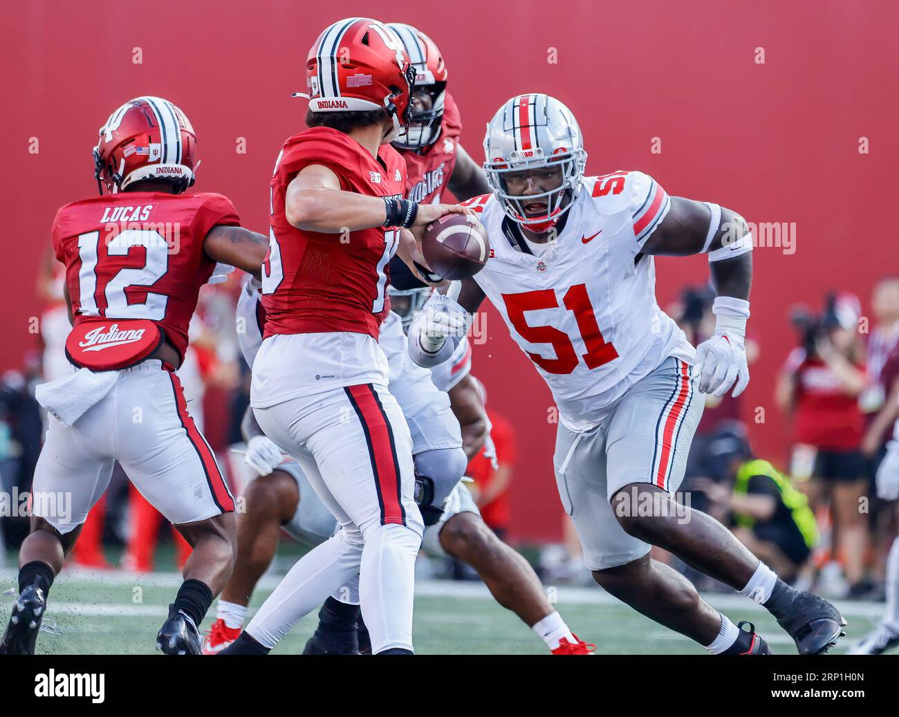 Bloomington, United States. 02nd Sep, 2023. Ohio State Buckeyes defensive tackle Michael Hall Jr. (51) tackles Indiana Hoosiers quarterback Dexter Williams II (5) during an NCAA football game in Bloomington. The Buckeyes beat the Hoosiers 23-3. Credit: SOPA Images Limited/Alamy Live News Stock Photo