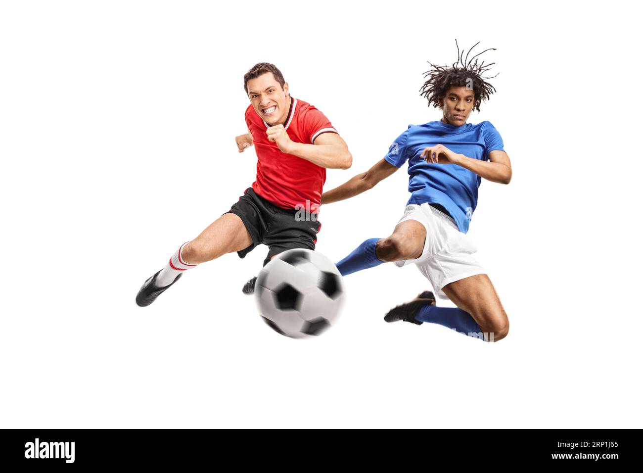 African american and caucasian football players jumping and kicking a ball isolated on white background Stock Photo