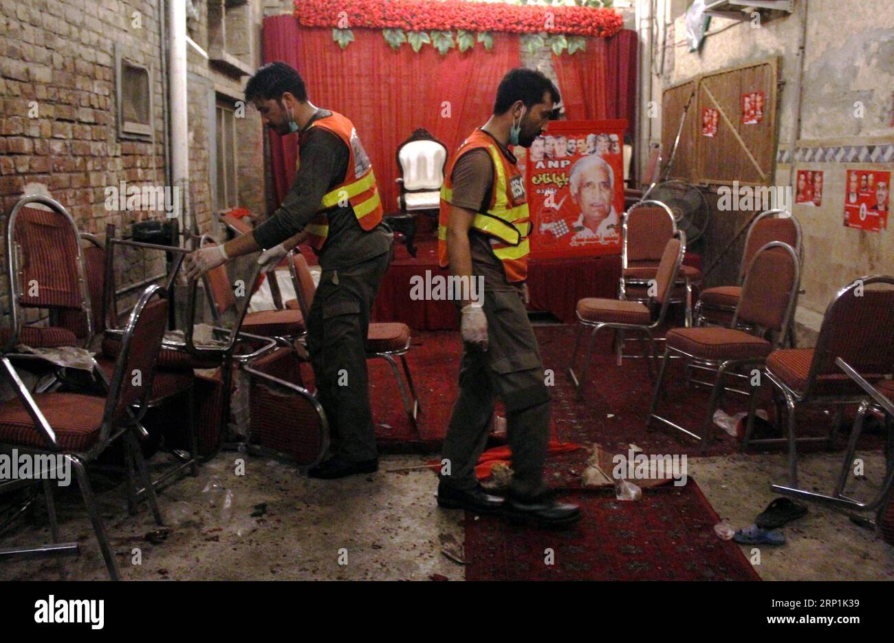 (180710) -- PESHAWAR, July 10, 2018 -- Rescuers work at the blast site in Peshawar, northwest Pakistan, on July 10, 2018. At least 13 people were killed and dozens of others injured in a blast that hit a public gathering of a political party in Pakistan s northwest provincial capital of Peshawar on Tuesday night, local media reported. ) PAKISTAN-PESHAWAR-BLAST SaeedxAhmad PUBLICATIONxNOTxINxCHN Stock Photo