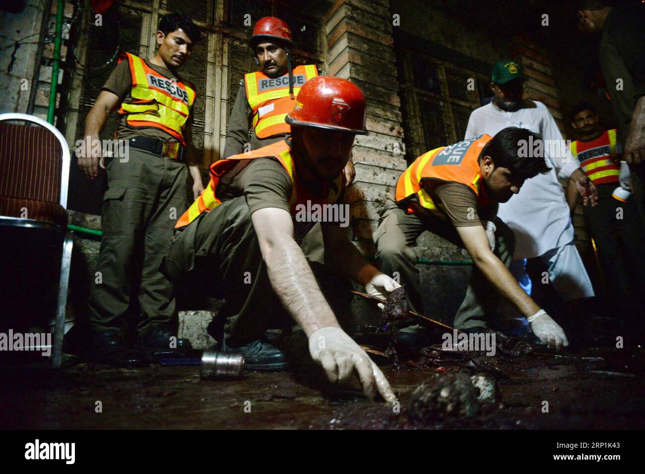 (180710) -- PESHAWAR, July 10, 2018 -- Rescuers work at the blast site in Peshawar, northwest Pakistan, on July 10, 2018. At least 13 people were killed and dozens of others injured in a blast that hit a public gathering of a political party in Pakistan s northwest provincial capital of Peshawar on Tuesday night, local media reported. ) PAKISTAN-PESHAWAR-BLAST UmarxQayyum PUBLICATIONxNOTxINxCHN Stock Photo