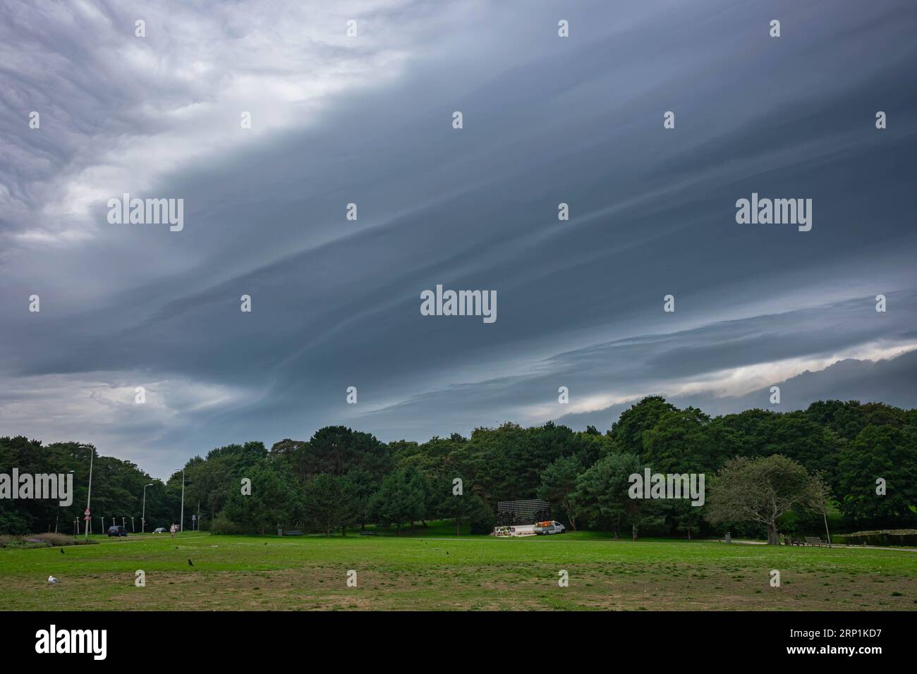 Emerging severe weather is preceded by a shelf cloud (arcus) with striations Stock Photo