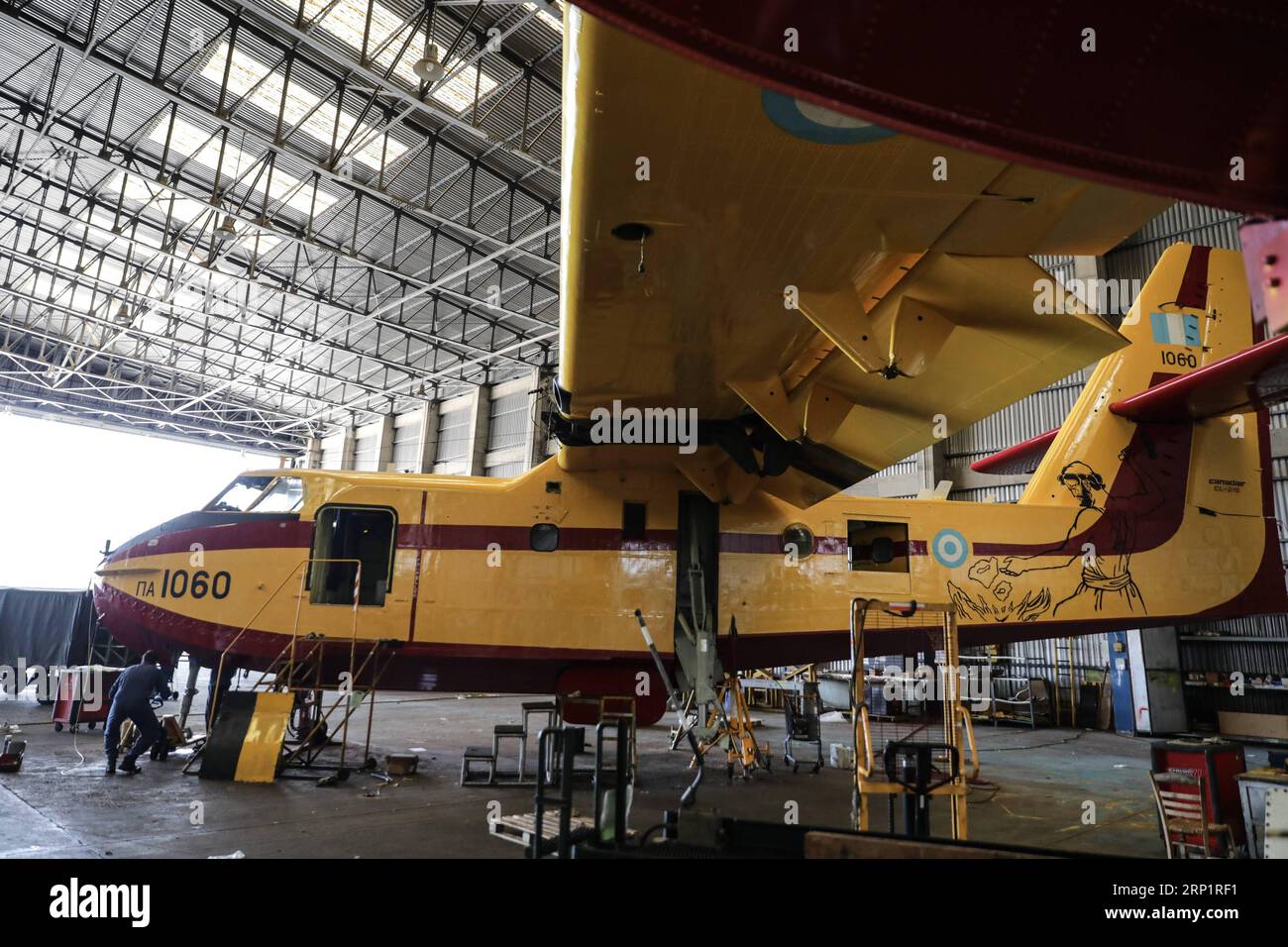 (180721) -- ATHENS, July 21, 2018 -- Engineers of Canadair firefighting aircraft fix an aircraft at Elefsina Air Base, Athens, Greece, on July 20, 2018. The 355 Tactical Transport Squadron was established in 1947 to fight wildfires. ) (zcc) GREECE-ATHENS-FIREFIGHTING SQUADRON LefterisxPartsalis PUBLICATIONxNOTxINxCHN Stock Photo