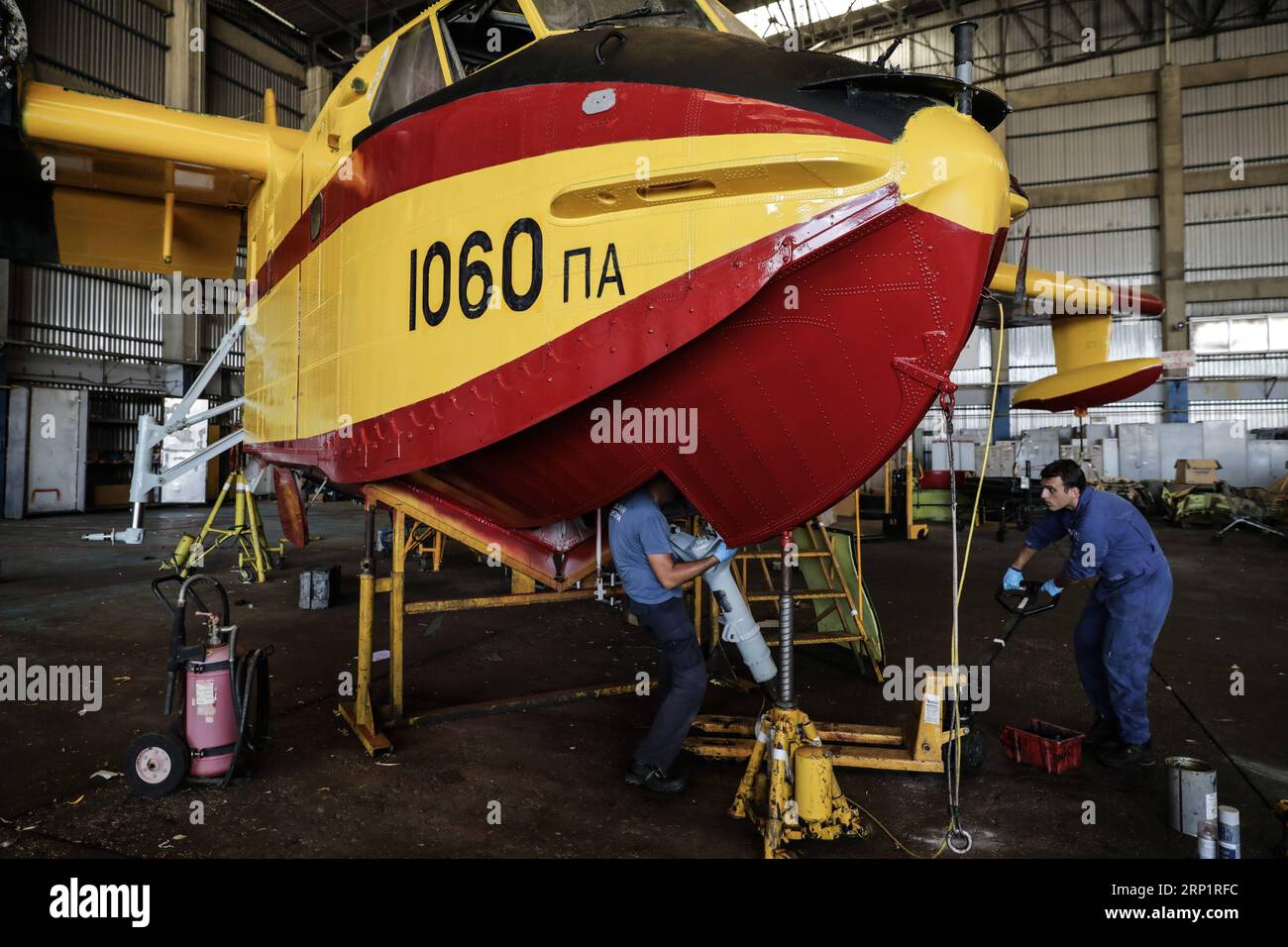 (180721) -- ATHENS, July 21, 2018 -- Engineers of Canadair firefighting aircraft fix an aircraft at Elefsina Air Base, Athens, Greece, on July 20, 2018. The 355 Tactical Transport Squadron was established in 1947 to fight wildfires. ) (zcc) GREECE-ATHENS-FIREFIGHTING SQUADRON LefterisxPartsalis PUBLICATIONxNOTxINxCHN Stock Photo