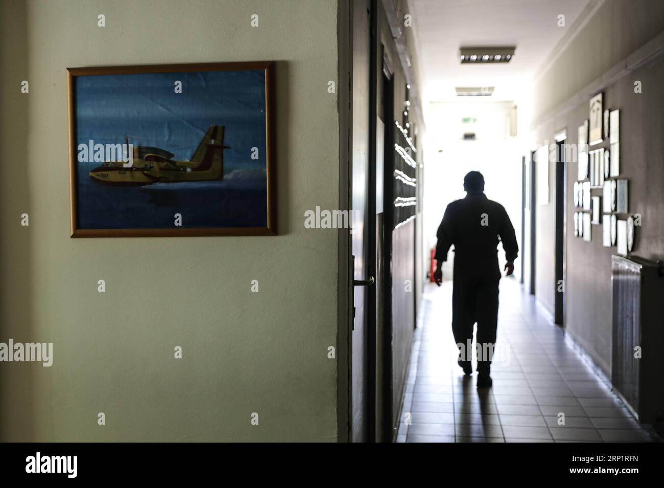 (180721) -- ATHENS, July 21, 2018 -- Operations officer Fotis Gavrilis walks in the building of 355 Tactical Transport Squadron at Elefsina Air Base, Athens, Greece, on July 20, 2018. The 355 Tactical Transport Squadron was established in 1947 to fight wildfires. ) (zcc) GREECE-ATHENS-FIREFIGHTING SQUADRON LefterisxPartsalis PUBLICATIONxNOTxINxCHN Stock Photo