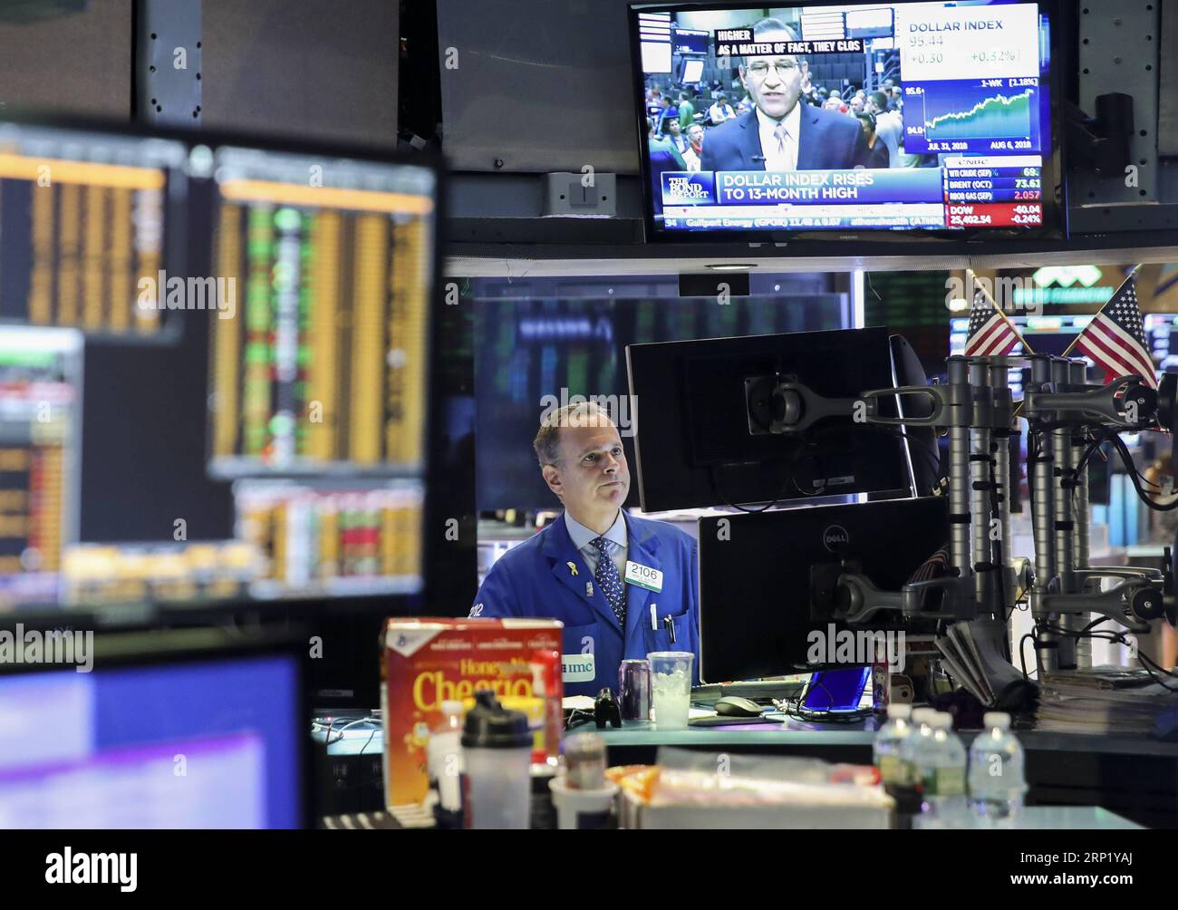 (180806) -- NEW YORK, Aug. 6, 2018 -- A trader works at the New York Stock Exchange in New York, the United States, Aug. 6, 2018. U.S. stocks closed higher on Monday as investors digested a batch of second-quarter corporate earnings reports. The Dow Jones Industrial Average rose 39.60 points, or 0.16 percent, to 25,502.18. The S&P 500 increased 10.05 points, or 0.35 percent, to 2,850.40. The Nasdaq Composite Index rose 47.66 points, or 0.61 percent, to 7,859.68. ) U.S.-NEW YORK-STOCKS WangxYing PUBLICATIONxNOTxINxCHN Stock Photo