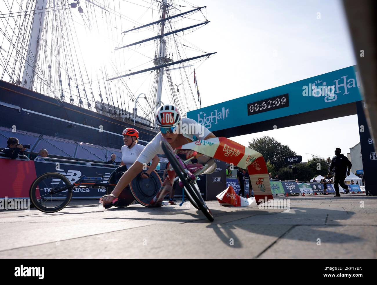 Samantha Kinghorn caught in the tape as she crosses the finish line to