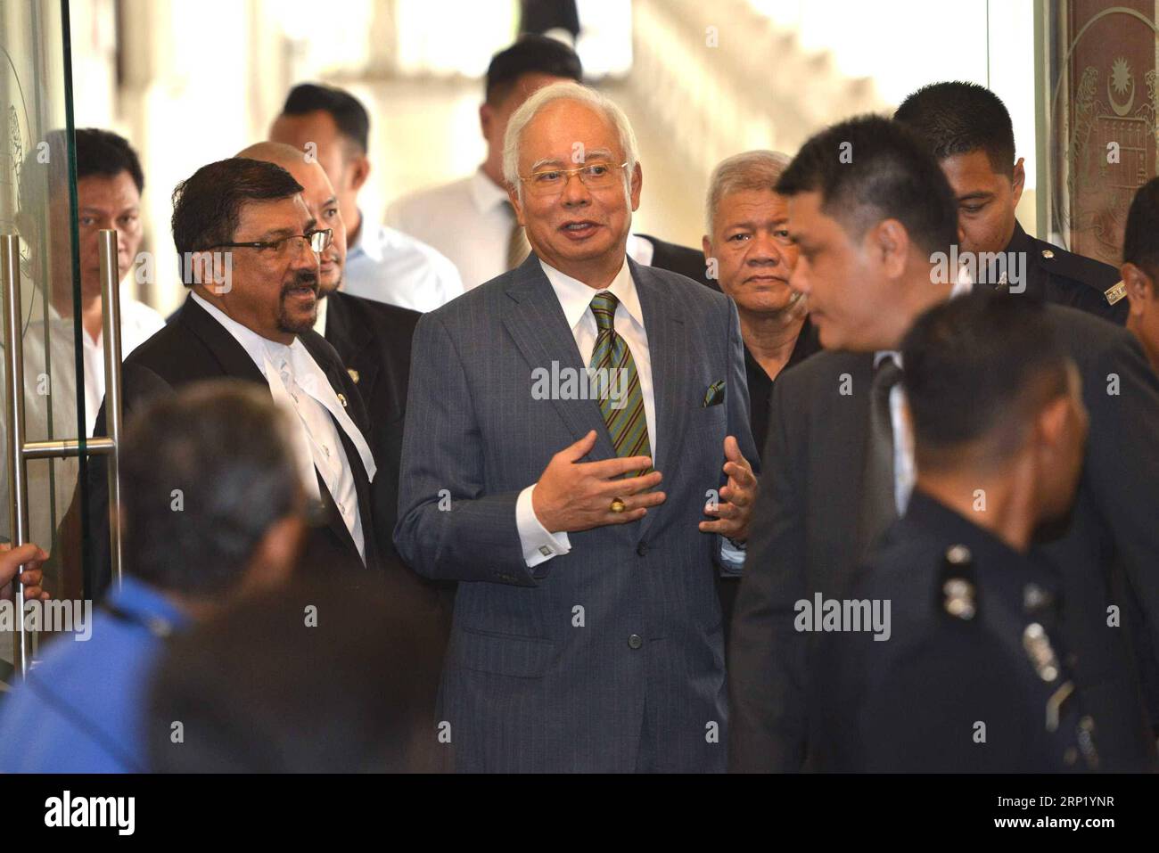 (180808) -- KUALA LUMPUR, Aug. 8, 2018 -- Former Malaysian Prime Minister Najib Razak (C) appears at the Kuala Lumpur Courts complex in Kuala Lumpur in Malaysia, Aug. 8, 2018. Former Malaysian Prime Minister Najib Razak on Wednesday was charged with three offenses related to money-laundering and anti-terrorism financing, in addition to several counts of criminal breach of trust and corruption charges that were served in early July. ) (lrz) MALAYSIA-KUALA LUMPUR-NAJIB-CHARGES ChongxVoonxChung PUBLICATIONxNOTxINxCHN Stock Photo