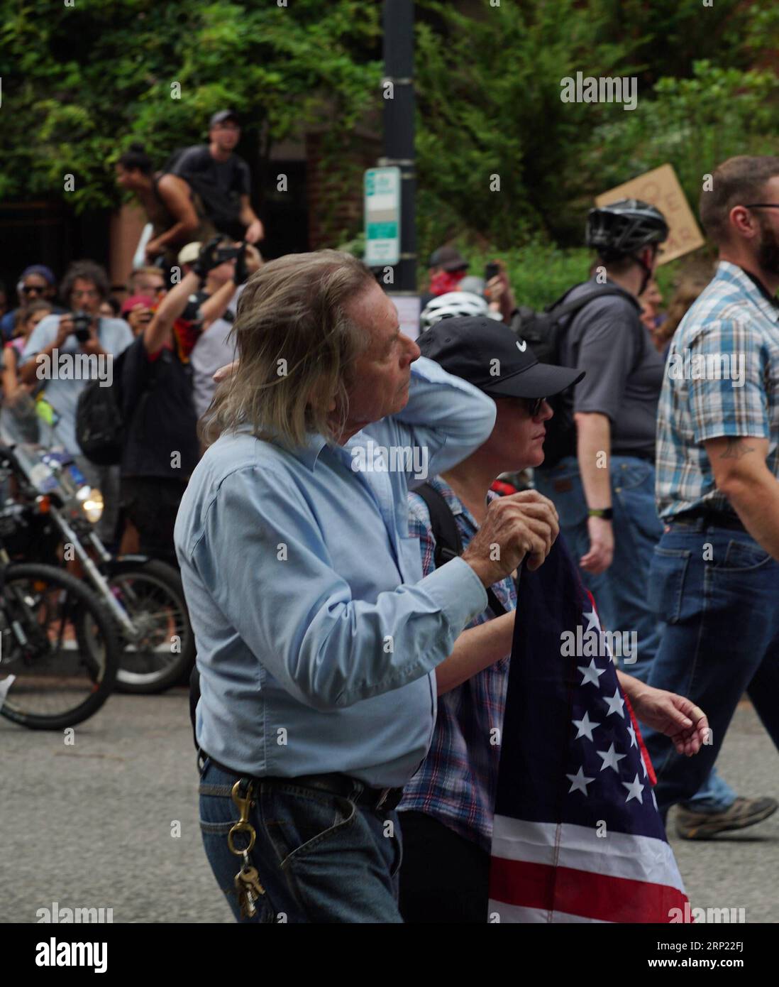 (180813) -- WASHINGTON, Aug. 13, 2018 -- A white supremacist (front) marches near the White House in Washington D.C., the United States, on Aug. 12, 2018. It had been expected up to about 400 white supremacists to gather outside the White House on Sunday. However, by 4:00 pm local time, only dozens of them emerged and marched through Washington D.C., accompanied by huge boos from crowded counterprotesters separated by heavy police presence. )(zhf) U.S.-WASHINGTON D.C.-FAR RIGHT RALLY HuxYousong PUBLICATIONxNOTxINxCHN Stock Photo