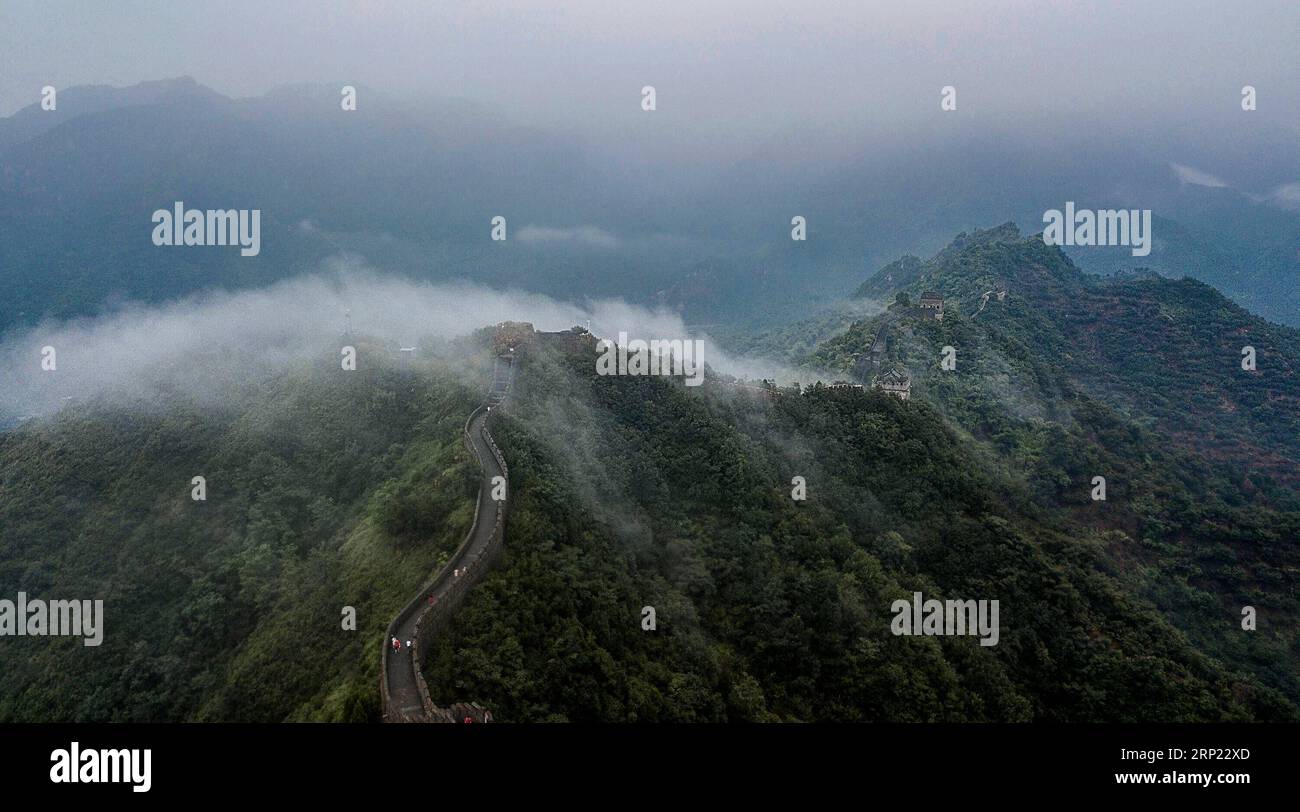 (180814) -- TIANJIN, Aug. 14, 2018 (Xinhua) -- Photo taken on Aug. 13, 2018 shows cloud and fog after a rainfall at Huangyaguan section of the Great Wall in the Jizhou District of Tianjin, north China. (Xinhua/Wang Guangshan) CHINA-TIANJIN-GREAT WALL-SCENERY (CN) PUBLICATIONxNOTxINxCHN Stock Photo