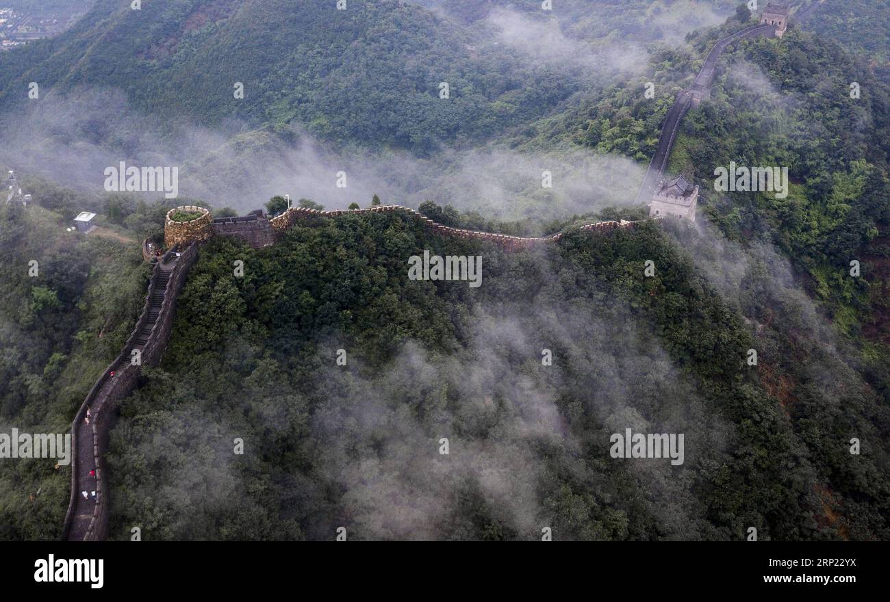 (180814) -- TIANJIN, Aug. 14, 2018 (Xinhua) -- Photo taken on Aug. 13, 2018 shows cloud and fog after a rainfall at Huangyaguan section of the Great Wall in the Jizhou District of Tianjin, north China. (Xinhua/Wang Guangshan) CHINA-TIANJIN-GREAT WALL-SCENERY (CN) PUBLICATIONxNOTxINxCHN Stock Photo