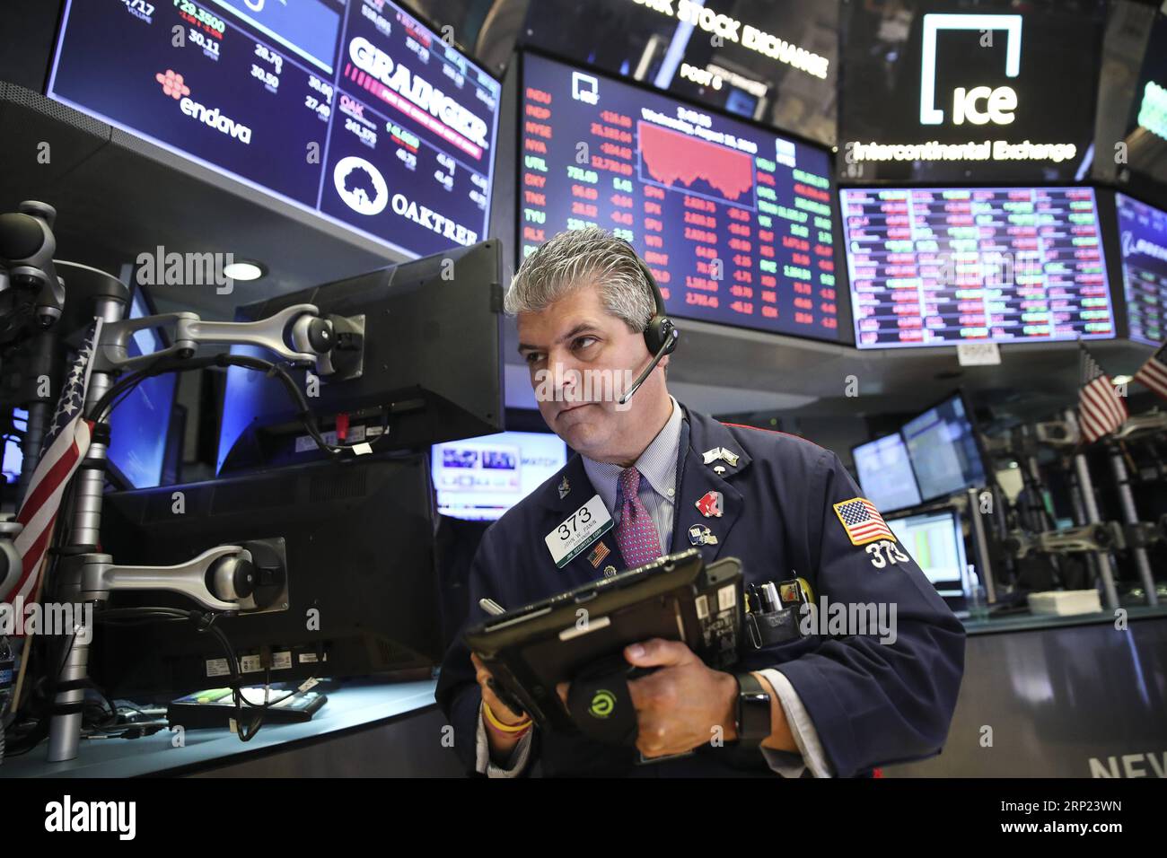 (180815) -- NEW YORK, Aug. 15, 2018 -- A trader works at the New York Stock Exchange in New York, the United States, on Aug. 15, 2018. U.S. stocks closed lower on Wednesday. The Dow Jones Industrial Average fell 137.51 points, or 0.54 percent, to 25,162.41. The S&P 500 was down 21.59 points, or 0.76 percent, to 2,818.37. The Nasdaq Composite Index dropped 96.78 points, or 1.23 percent, to 7,774.12. ) U.S.-NEW YORK-STOCKS WangxYing PUBLICATIONxNOTxINxCHN Stock Photo
