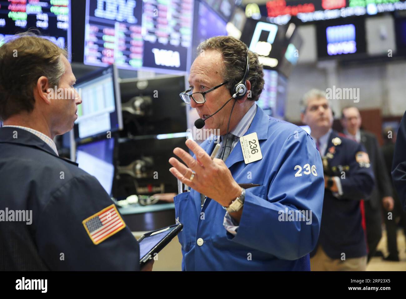 (180815) -- NEW YORK, Aug. 15, 2018 -- Traders work at the New York Stock Exchange in New York, the United States, on Aug. 15, 2018. U.S. stocks closed lower on Wednesday. The Dow Jones Industrial Average fell 137.51 points, or 0.54 percent, to 25,162.41. The S&P 500 was down 21.59 points, or 0.76 percent, to 2,818.37. The Nasdaq Composite Index dropped 96.78 points, or 1.23 percent, to 7,774.12. ) U.S.-NEW YORK-STOCKS WangxYing PUBLICATIONxNOTxINxCHN Stock Photo