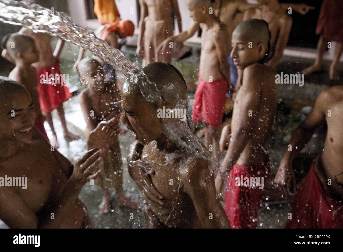 (180826) -- KATHMANDU, Aug. 26, 2018 -- Young Hindu priests take bath during the Janai Purnima festival at the Pashupatinath Temple in Kathmandu, Nepal on Aug. 26, 2018. During this festival, Hindus take holy bath and perform annual change of the Janai, a sacred cotton string worn around their chest or tied on the wrist, in the belief that it will protect and purify them. ) (dtf) NEPAL-KATHMANDU-JANAI PURNIMA-FESTIVAL sulavxshrestha PUBLICATIONxNOTxINxCHN Stock Photo