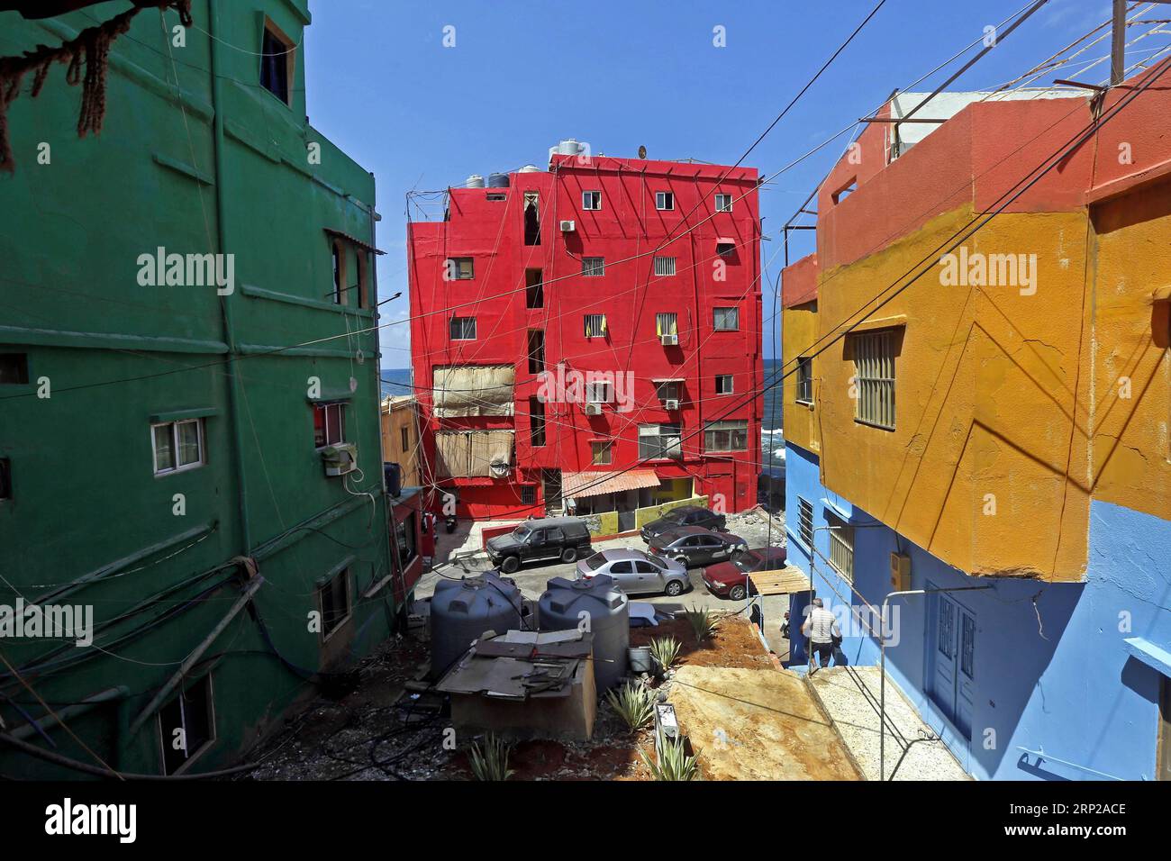 (180827) -- OUZAI, Aug. 27, 2018 -- Buildings with colorful paintings are seen on the beach in Ouzai, south of Beirut, Lebanon, on Aug. 26, 2018. ) (jmmn) LEBANON-OUZAI-BUILDINGS BilalxJawich PUBLICATIONxNOTxINxCHN Stock Photo