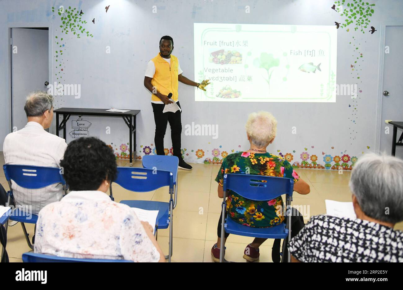 (180901) -- GUANGZHOU, Sept. 1, 2018 -- African student Kabey Heritier Lweny (C) teaches Chinese senior citizens English in Guangzhou, south China s Guangdong Province, Aug. 29, 2018. Kabey, who comes from the Democratic Republic of Congo, came to Guangdong University of Technology as a Chinese language major about a year ago. The rich Chinese cuisine and culture have always appealed to him, but it s by taking part in various volunteer activities that has made him embrace the life in Guangzhou ever more closely. I grew to learn more about the Chinese traditions and lifestyles as I joined Chine Stock Photo