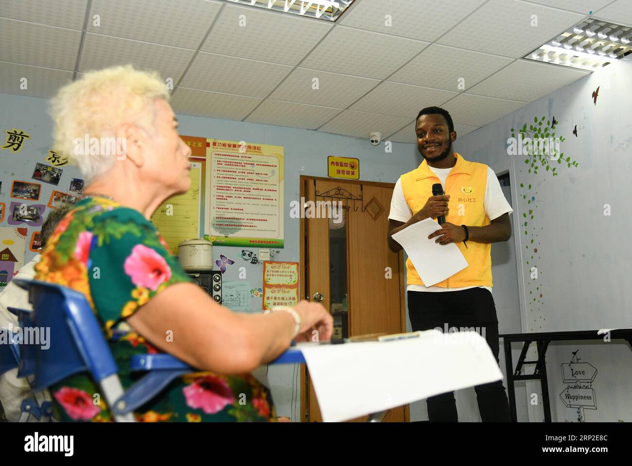 (180901) -- GUANGZHOU, Sept. 1, 2018 -- African student Kabey Heritier Lweny (R) teaches Chinese senior citizens English in Guangzhou, south China s Guangdong Province, Aug. 29, 2018. Kabey, who comes from the Democratic Republic of Congo, came to Guangdong University of Technology as a Chinese language major about a year ago. The rich Chinese cuisine and culture have always appealed to him, but it s by taking part in various volunteer activities that has made him embrace the life in Guangzhou ever more closely. I grew to learn more about the Chinese traditions and lifestyles as I joined Chine Stock Photo