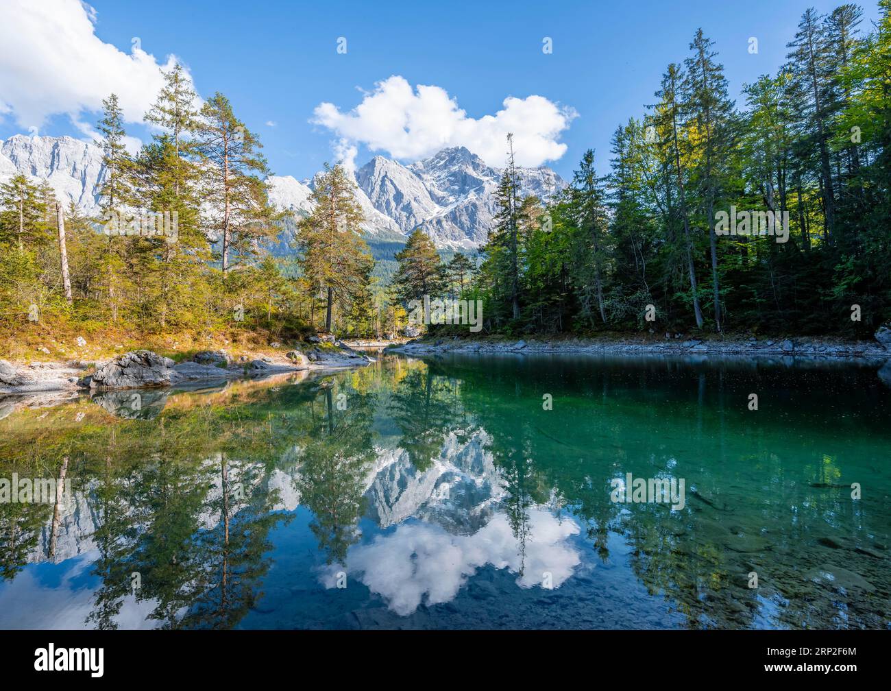 Zugspitze is reflected in lake eibsee hi-res stock photography and ...