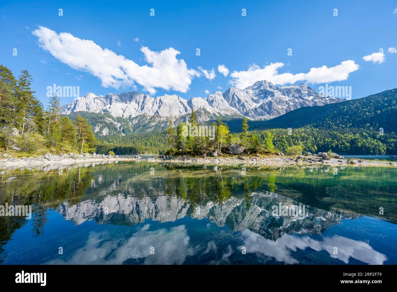 Zugspitze is reflected in lake eibsee hi-res stock photography and ...