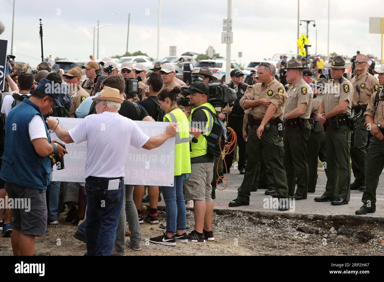 (180903) -- CHICAGO, Sept. 3, 2018 -- Protesters confront Illinois State Police in Chicago, the United States, on Sept. 3, 2018. Police arrested 12 people attempting to block traffic on the highway leading to Chicago O Hare International Airport on Monday. The protesters demands include more African Americans in the construction workforce in Chicago, the repurposing of closed schools, economic investment in African American neighborhoods, resources for black led anti-violence initiatives, and the resignation of Mayor Rahm Emanuel. ) U.S.-CHICAGO-ANTI-VIOLENCE LABOR DAY PROTEST WangxPing PUBLIC Stock Photo