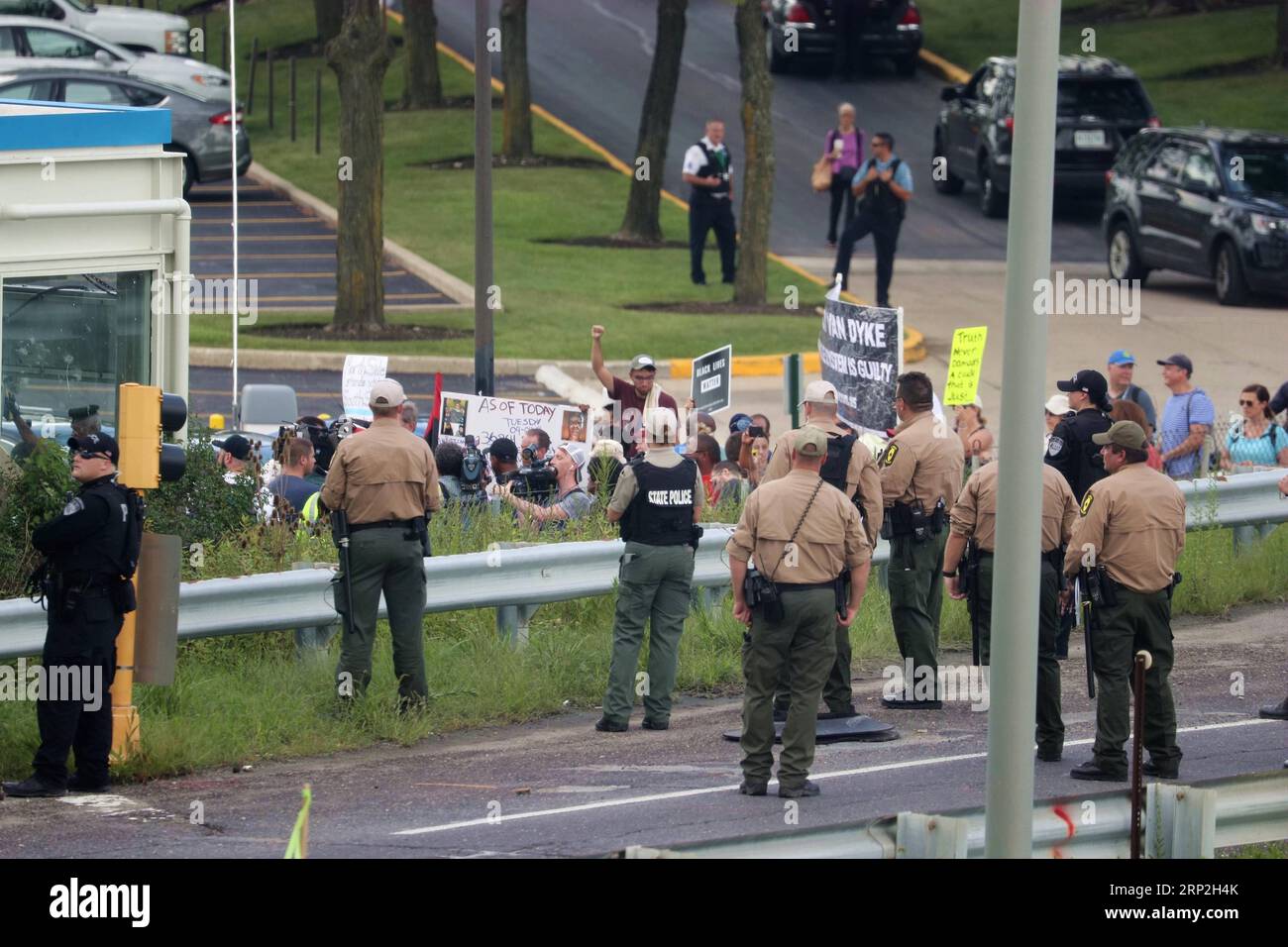 (180903) -- CHICAGO, Sept. 3, 2018 -- Protesters confront Illinois State Police in Chicago, the United States, on Sept. 3, 2018. Police arrested 12 people attempting to block traffic on the highway leading to Chicago O Hare International Airport on Monday. The protesters demands include more African Americans in the construction workforce in Chicago, the repurposing of closed schools, economic investment in African American neighborhoods, resources for black led anti-violence initiatives, and the resignation of Mayor Rahm Emanuel. ) U.S.-CHICAGO-ANTI-VIOLENCE LABOR DAY PROTEST WangxPing PUBLIC Stock Photo