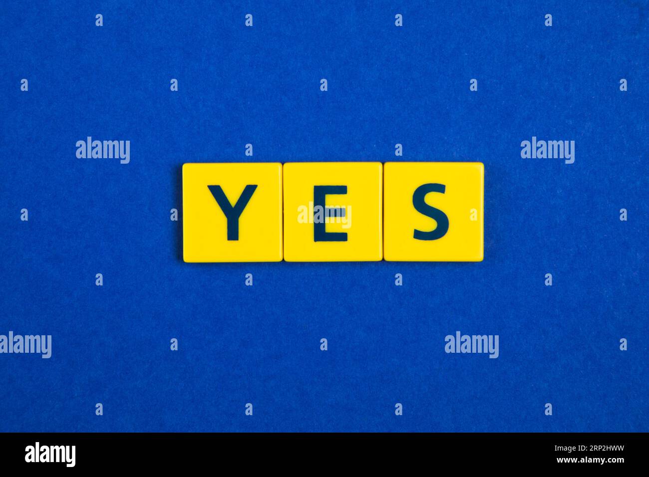 Yes word yellow tiles Stock Photo