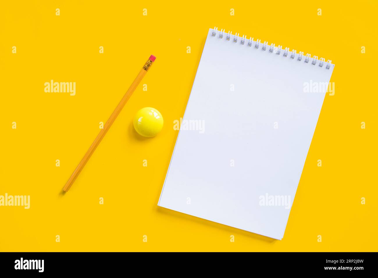 Composition notebook pencil yellow magnet Stock Photo